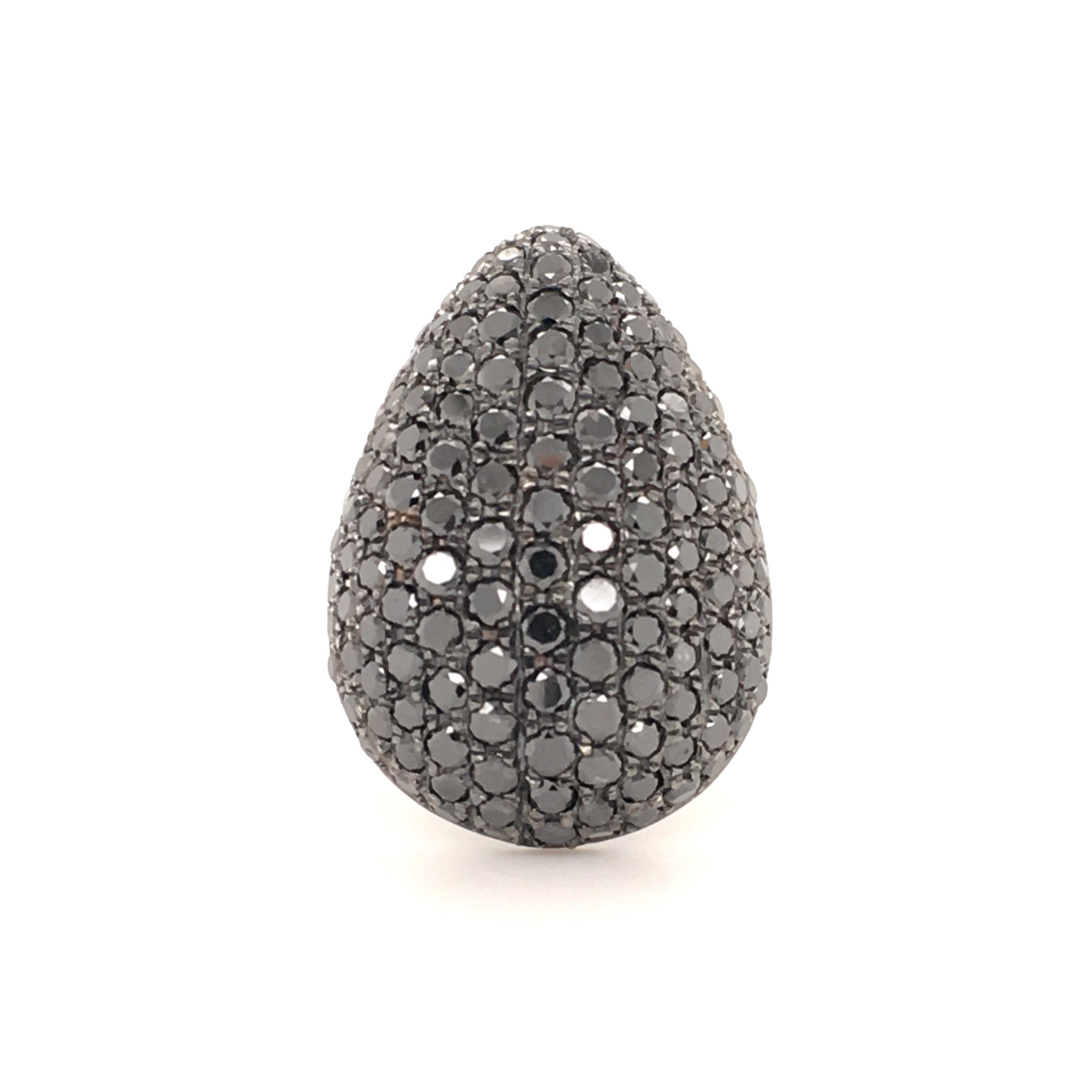 Pear shaped cocktail ring, pavé set with brilliant cut black diamonds, total weight 3.68 carats. Mounting in 18 karat white gold.
The exact diamond weight is engraved in the ring.

Size: 53 Europe / 6.5 US
Maker's mark: AK
Assay mark: 750