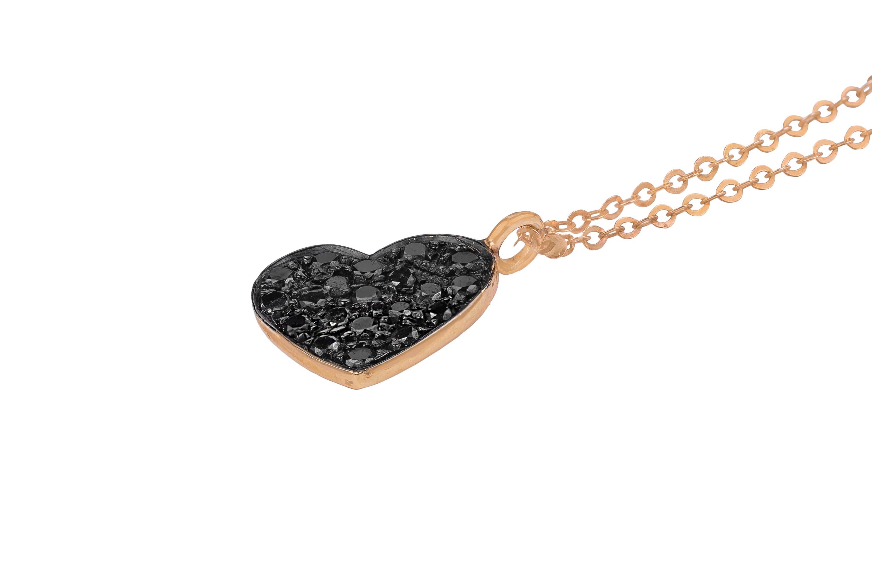 This classic and romantic 18K rose gold and black diamonds necklace is made in Italy by Fanuele Gioielli.
It features a heart shaped pendant covered by brilliant cut black diamonds.

Diamonds total content is 0.4ct 
Gold total content is 3.1gr
Total