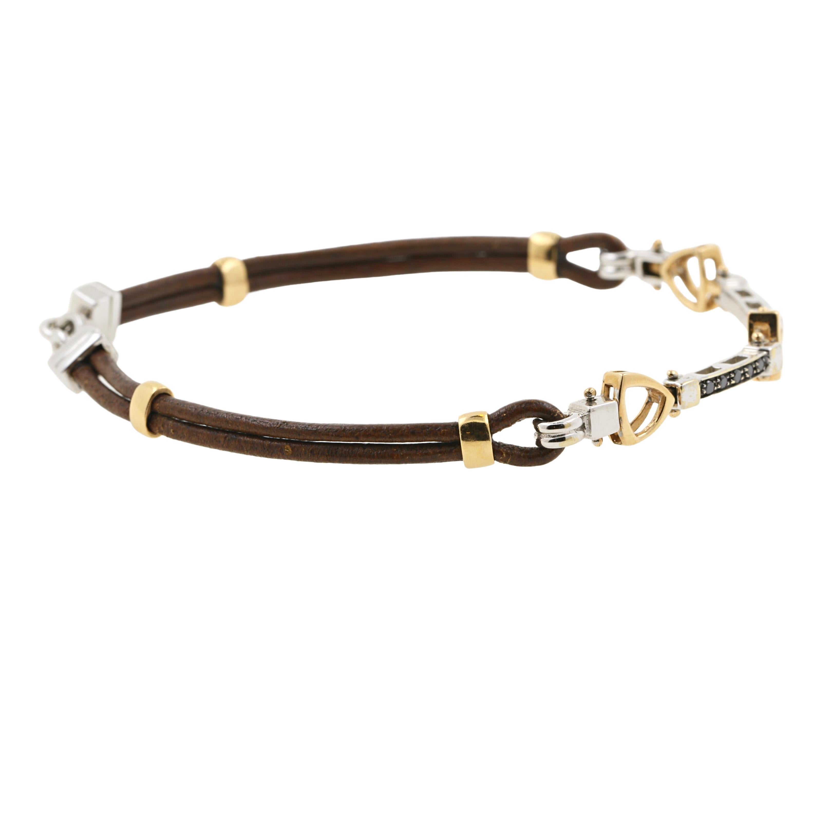 18k white and yellow gold and leather bracelet with black diamonds. 
The 2 central white gold elements are alternated with small yellow gold elements, leather and a white gold clasp. 
750 stamp. 
Total weight: 9.1 g ( for an estimated gold weight of