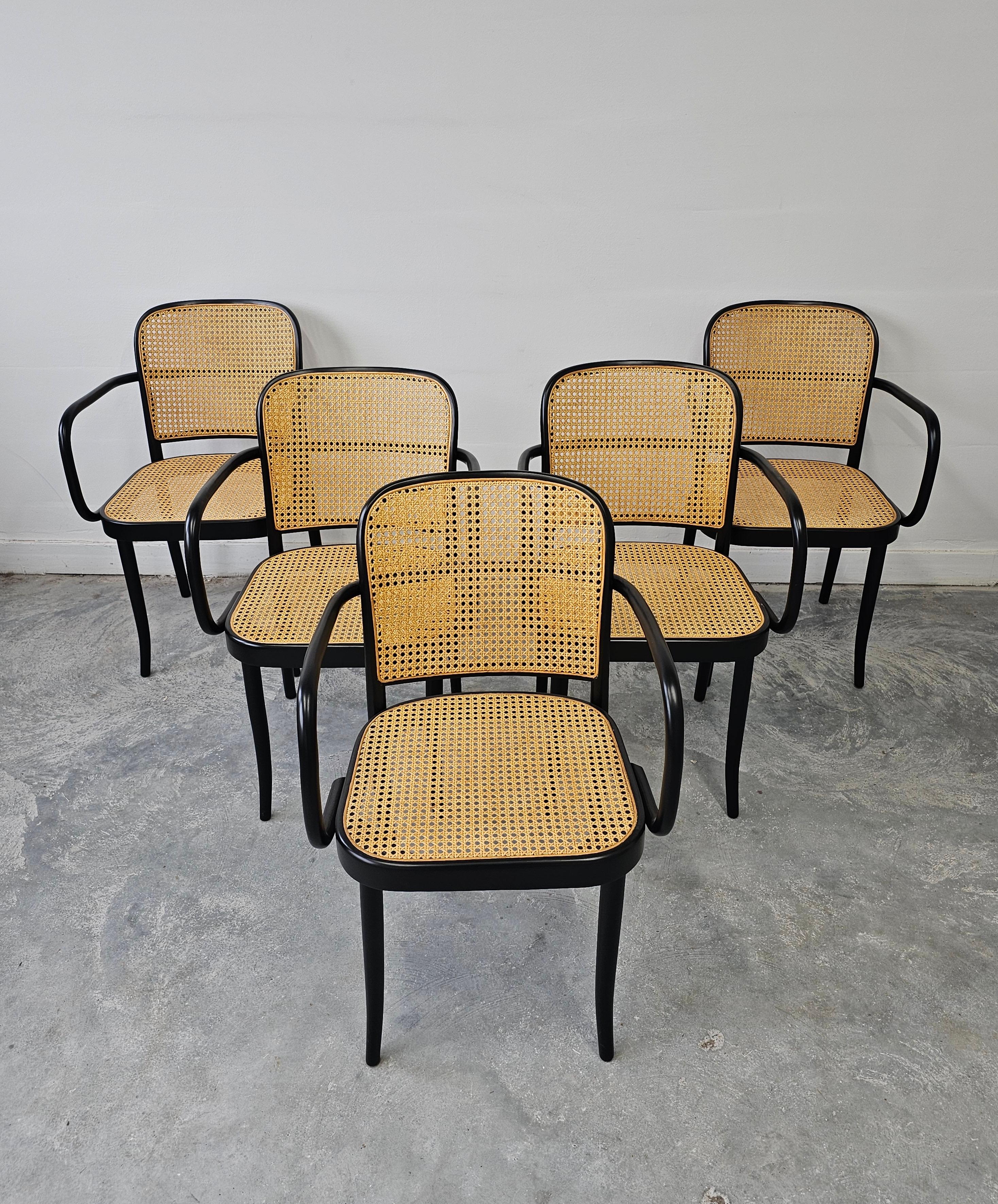 In this listing you will find rare vintage dining chairs designed by Josef Hoffmann for Mundus - Model Prague. Chairs are done in black painted beech bentwood with cane seats and backrest. There are 5 chairs available at the moment. Listed price is