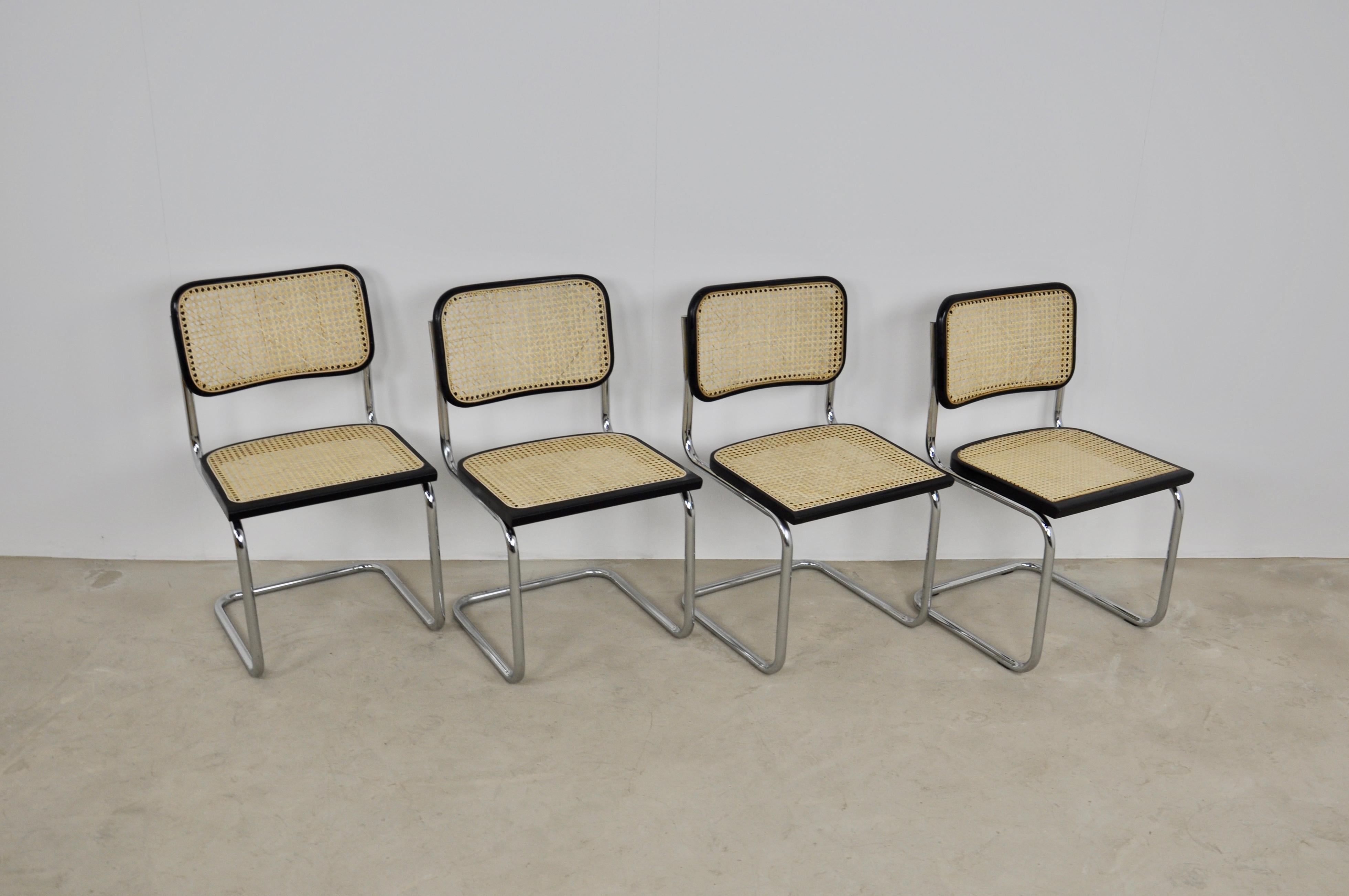 Set of 4 chairs in metal, wood and cane. Cane in perfect condition. Light wear due to time and use (1980s). Measures: Seat height 45cm.