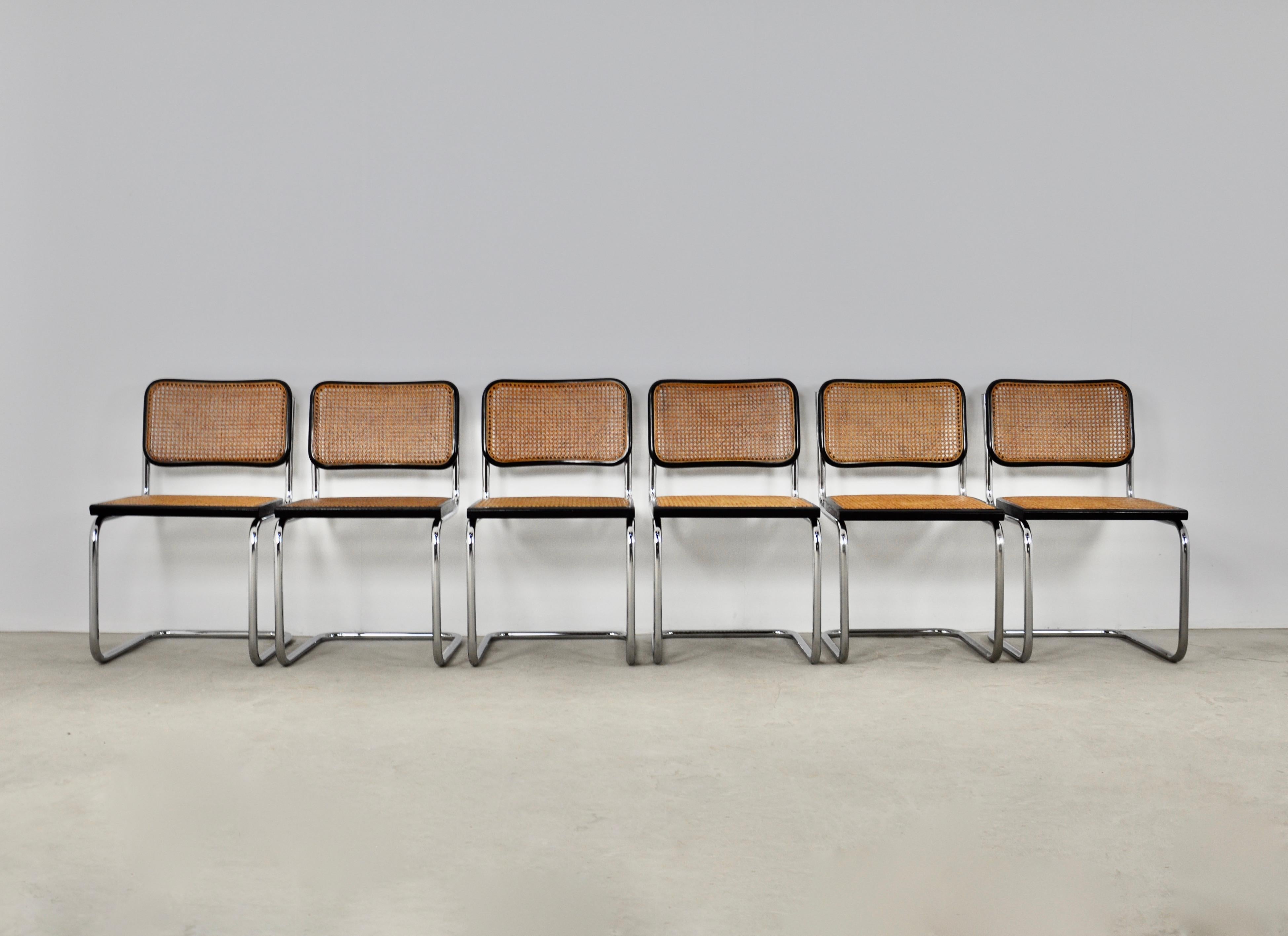 Set of 6 chairs in metal, wood and cane. Wear due to time and age of the chairs (see photo) 
Measure: Seat height: 46cm.