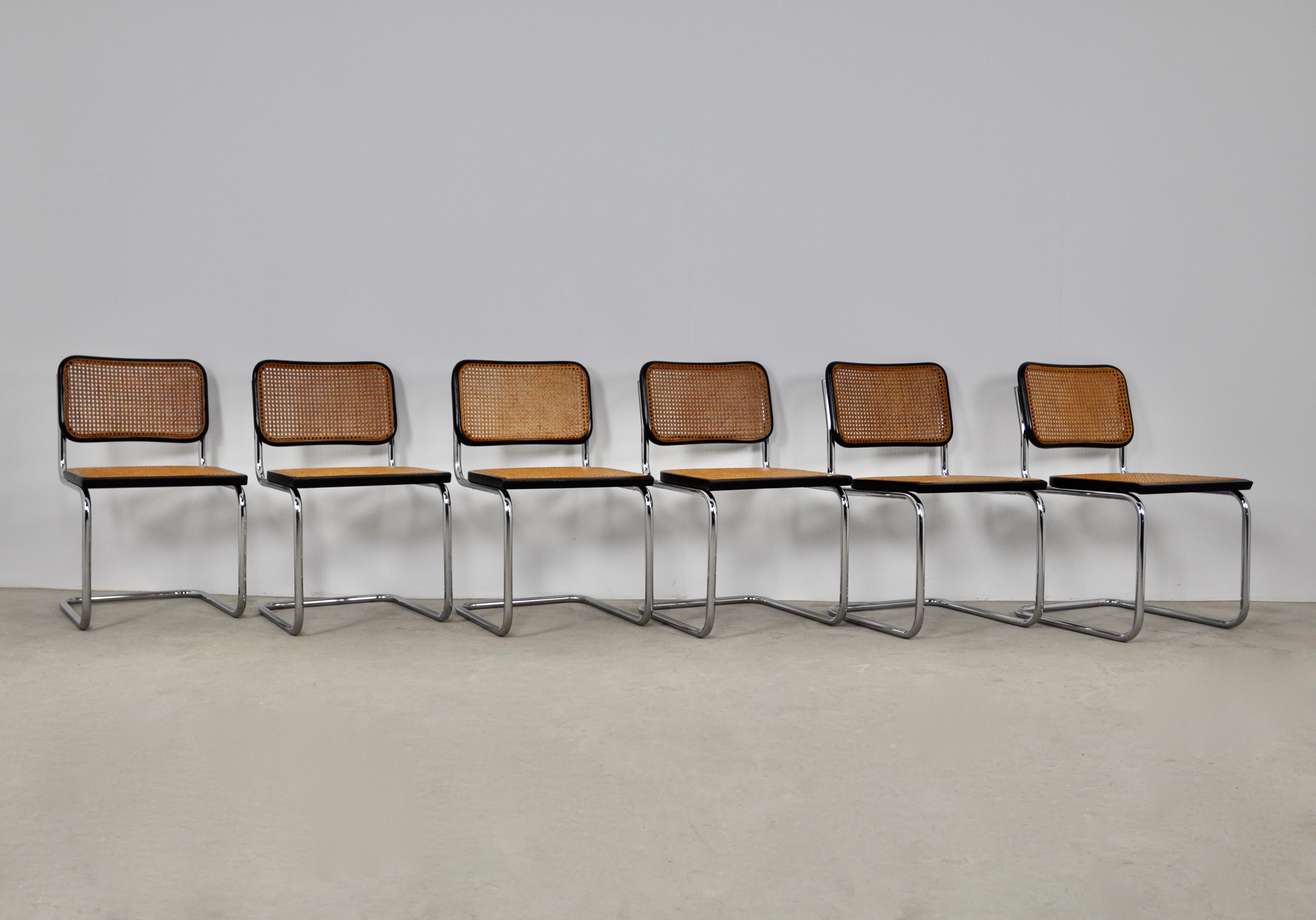 Set of 6 chairs in metal, wood and cane. Wear due to time and age of the chairs (see photo) 
Measure: Seat height: 46cm.