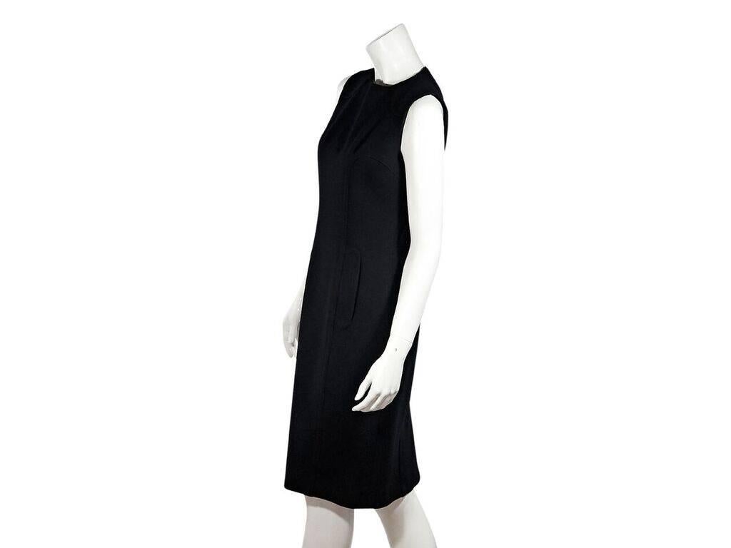 Product details:  Black virgin wool sheath dress by Dolce & Gabbana.  Crewneck.  Sleeveless.  Waist flap pockets.  Concealed back zip closure.  Back center hem vent.  36