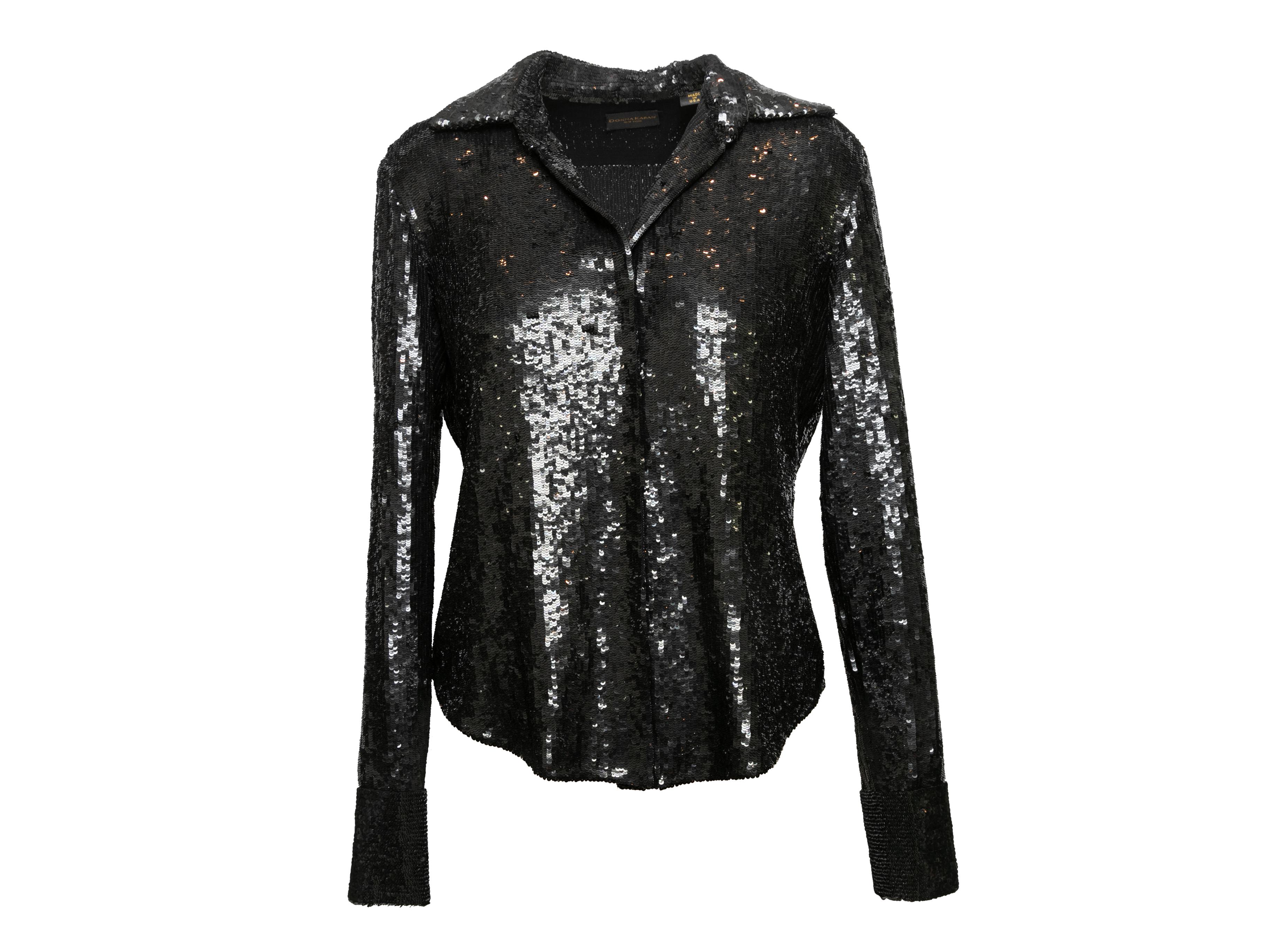 Black lightweight sequined jacket by Donna Karan. Pointed collar. Button closures at front. 34