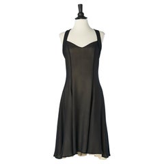 Robe de cocktail dos nu en mousseline de soie noire double lay ouverte dans le dos ROCHAS 