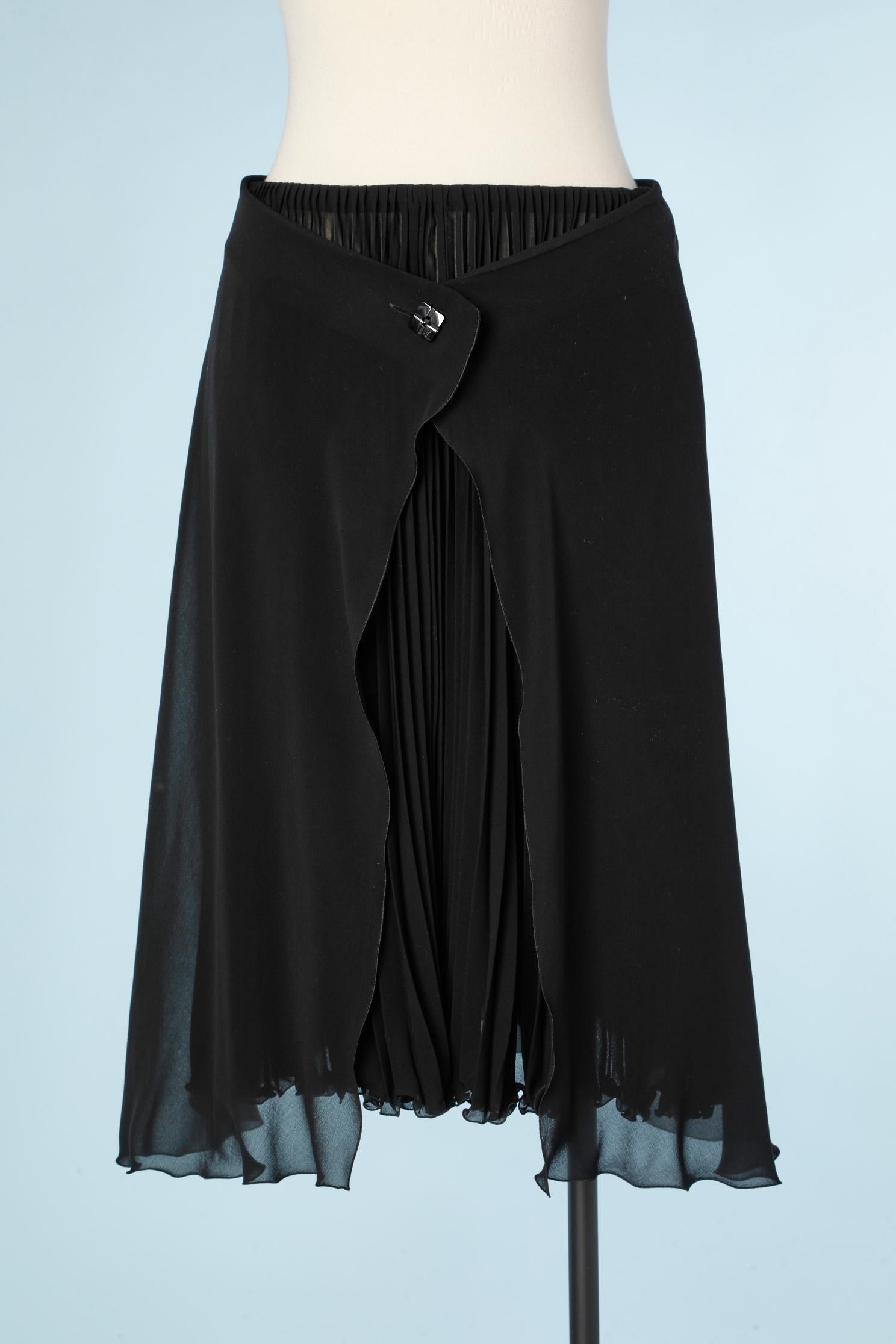 Black double lays chiffon skirt .The under lay is sunray pleated , the top skirt is button in the middle front with one branded button. 
SIZE 38 (M) 