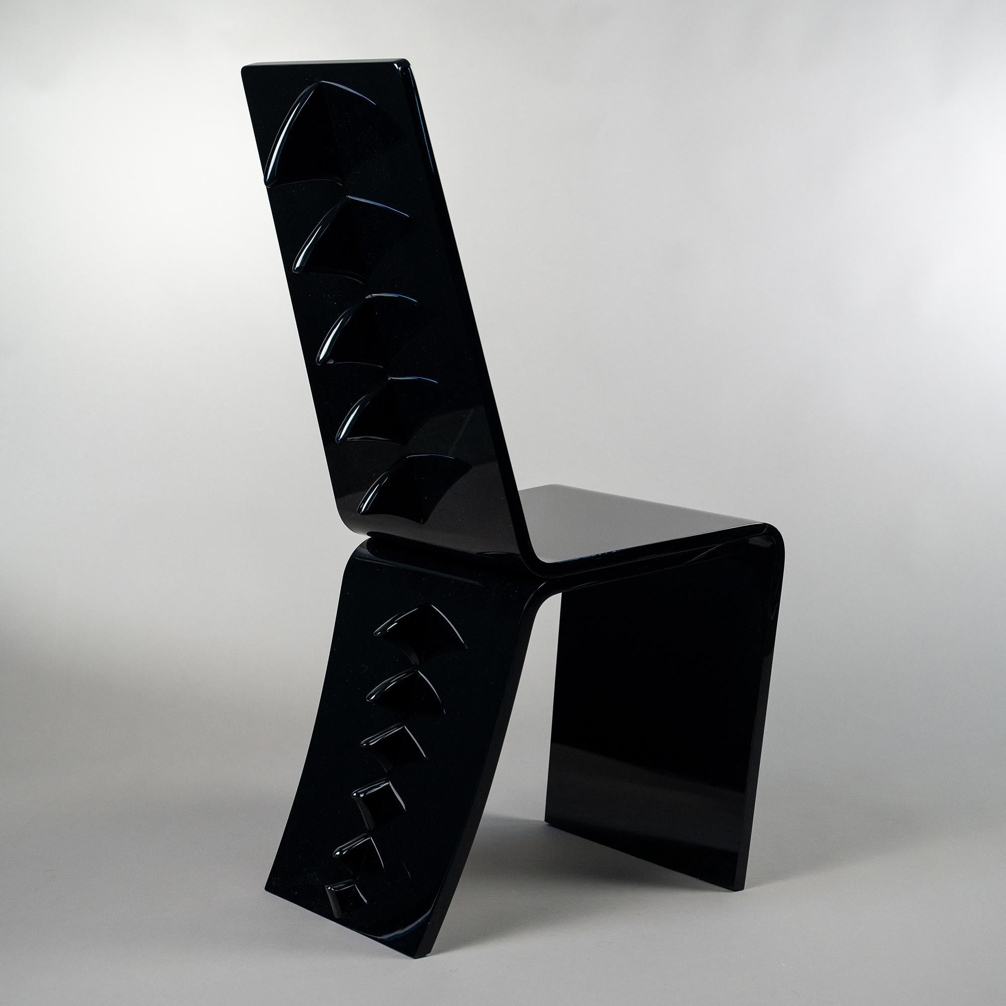 Black Dragon Chair by Giulia Maria Ligresti
Dimensions: D 60 x W 45 x H 114 cm.
Materials: PMMA.

Deftly crafted of black PMMA by the hands of skilled artisans, this dynamic and lightweight chair is an ode to dragons actualized in a sophisticated