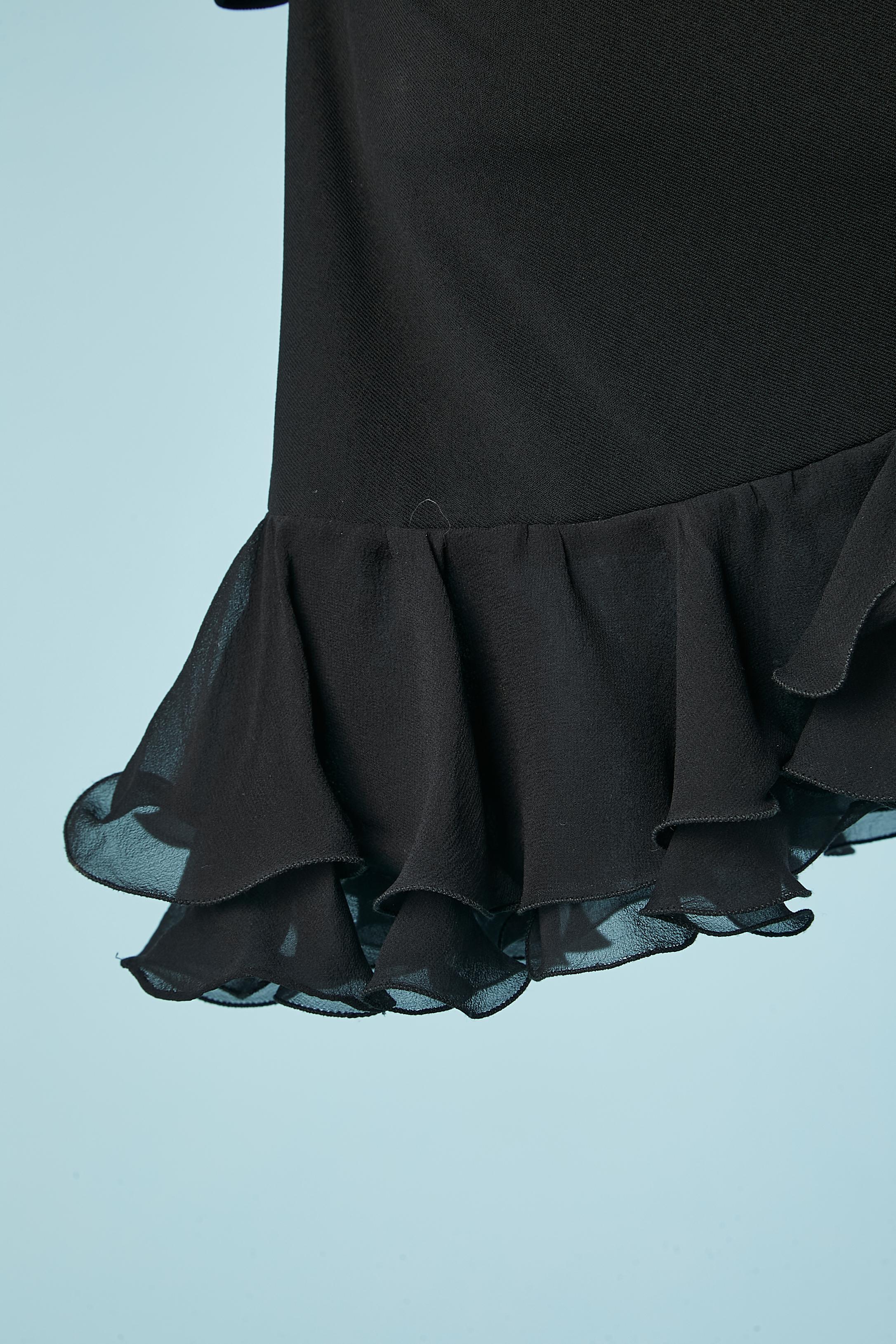 Black drape jersey cocktail dress with silk chiffon ruffles. Drape on both side. Zip on the left side. 
SIZE XS