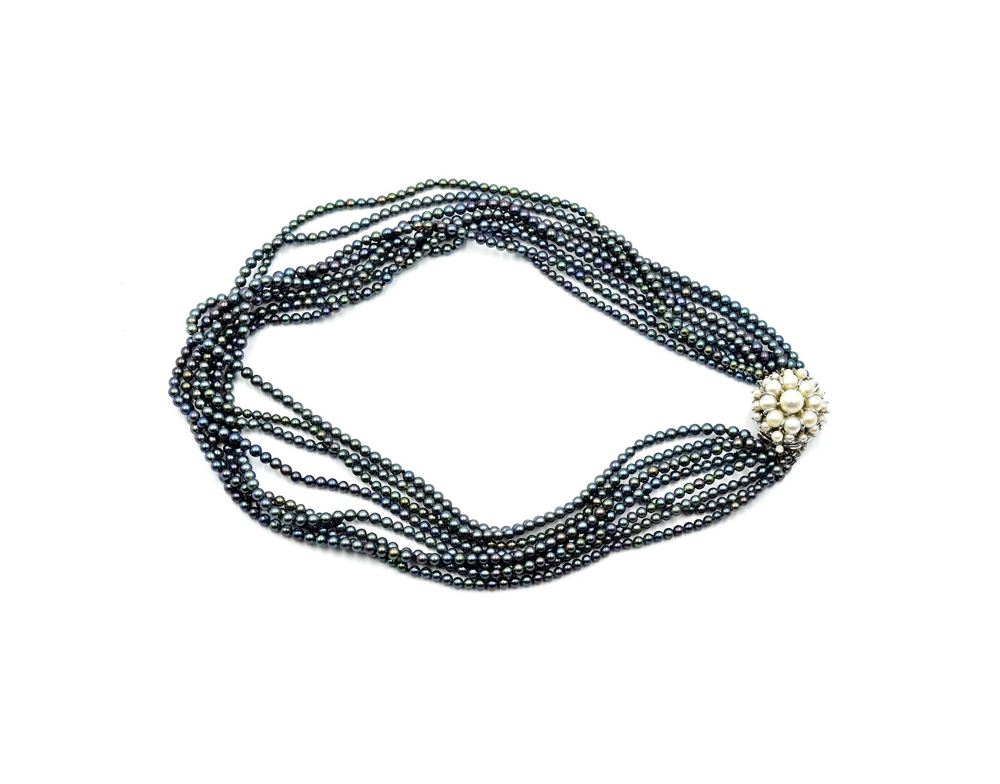 Designer: custom design
Material: 14k white gold clasp
White Cultured Pearls: cultured pearls with silver overtone 3.00mm – 6.66mm in diameter
Black Dyed Cultured Pearls: eight strands of black dyed cultured pearls 3.00mm in diameter
Dimensions: the