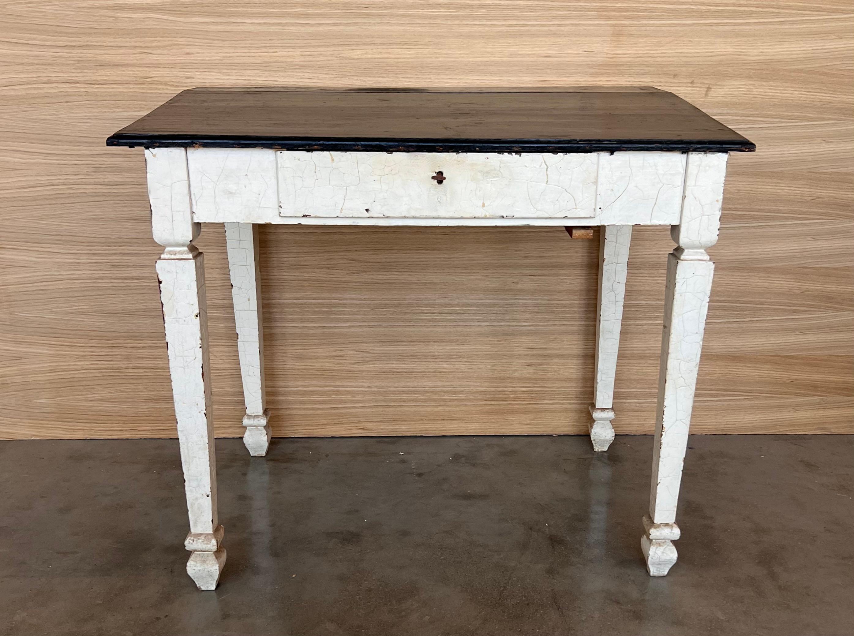Ebonized wood “architect desk” table, France, 19th century. On four tapered legs with a central knot stands the table, one drawers on the skirt, some boards on the sides and a sloping top with a large empty space This specific typology of desks is