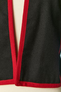 Black edge to edge boléro jacket with red piping Saint Laurent Rive Gauche