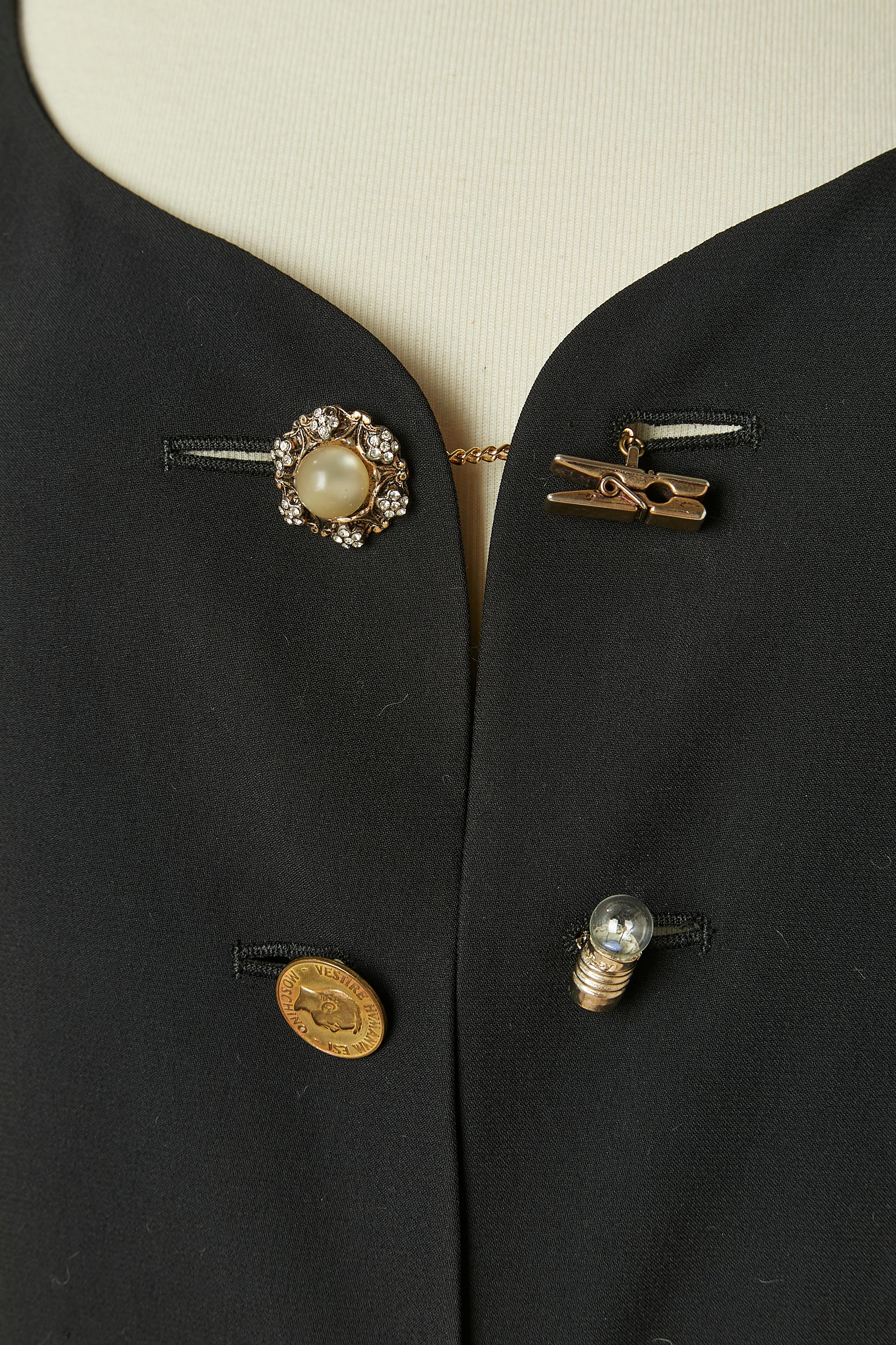 Black edge to edge jacket with mismatched buttons on the middle front and cuff. Main fabric composition: 50% rayon, 50% acetate. No tag composition for the printed lining but probably rayon. 
Decorative pocket on both side ( only pocket flap)