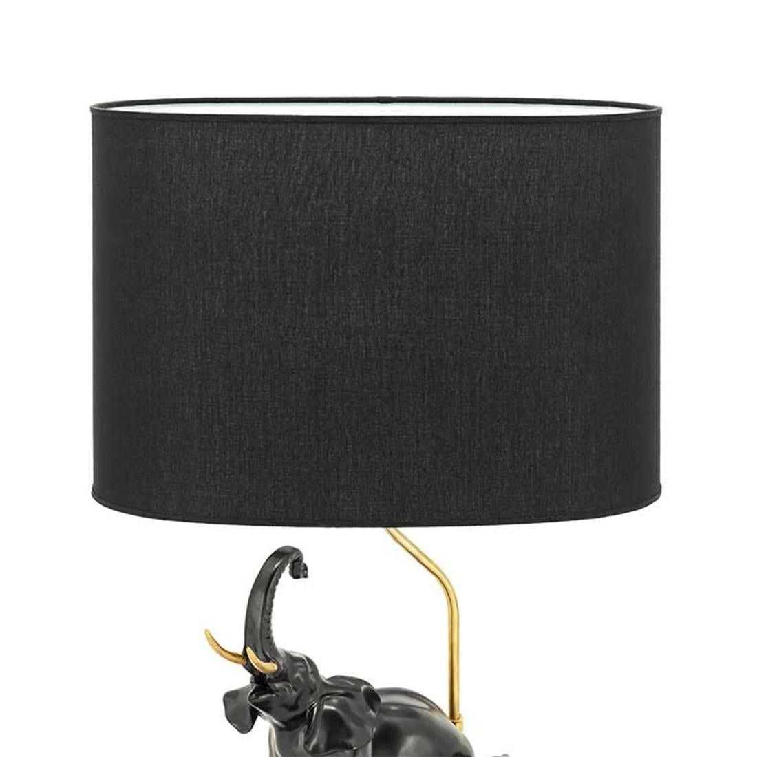 Table Lamp Black Elephants with porcelain base 
in black finish with gilded metal base. With brass
details on base. Shade in coton included.