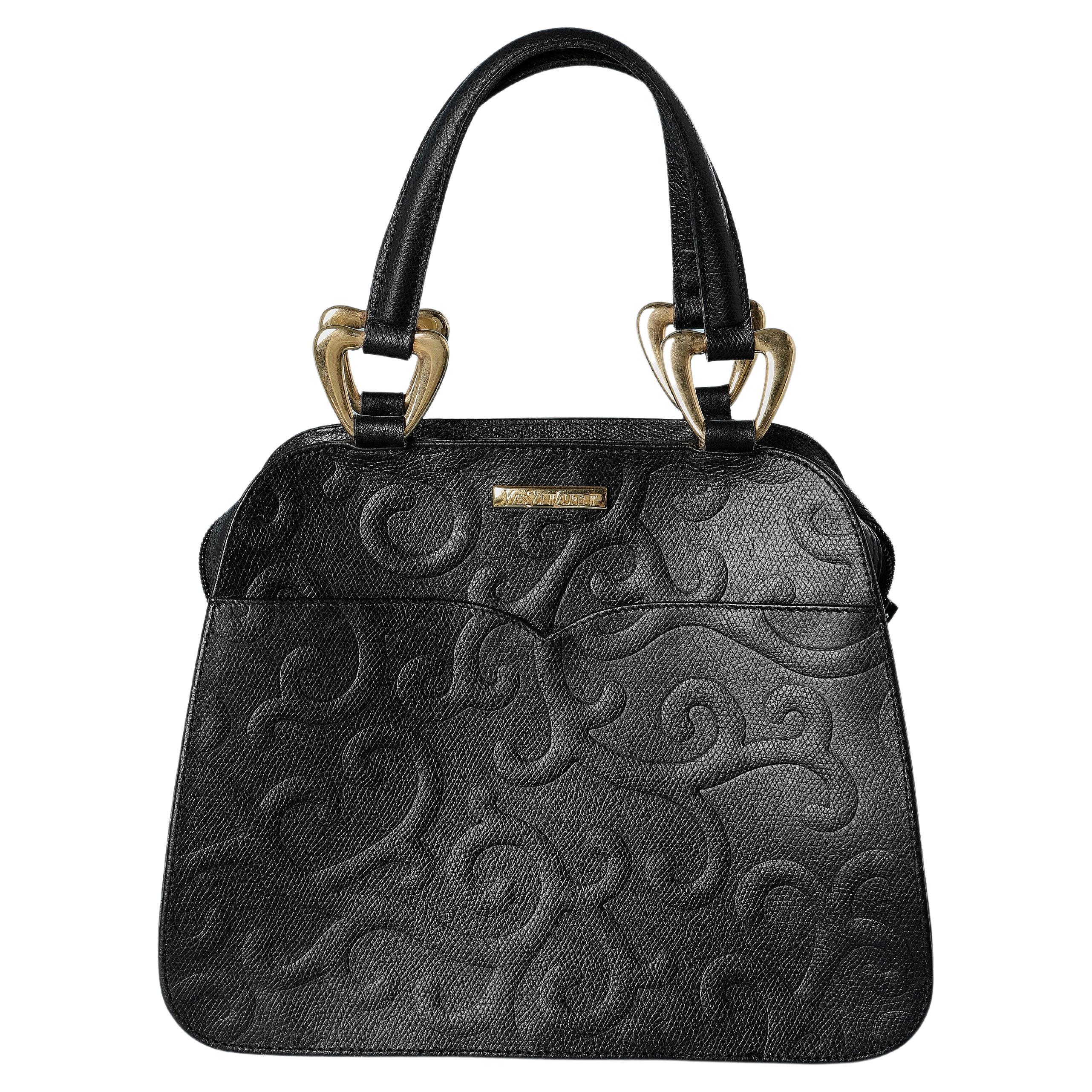 Black emboss leather hand bag Yves Saint Laurent  For Sale