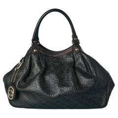Black embossed leather bag Guccissima Gucci Numbered