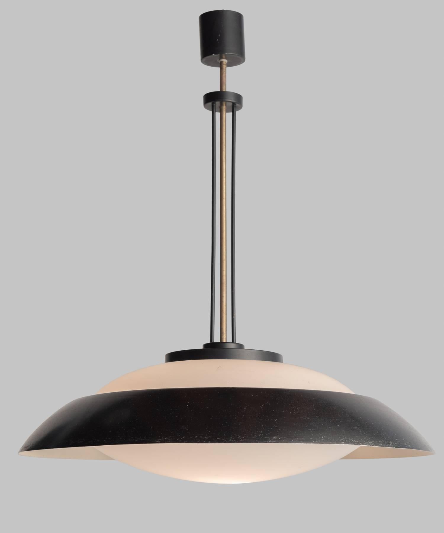 Black Enamel and Opaline Glass Ceiling Light, Italy, circa 1960

Elegant shade features a metal visor in a wonderful patina. 

Measure: 22