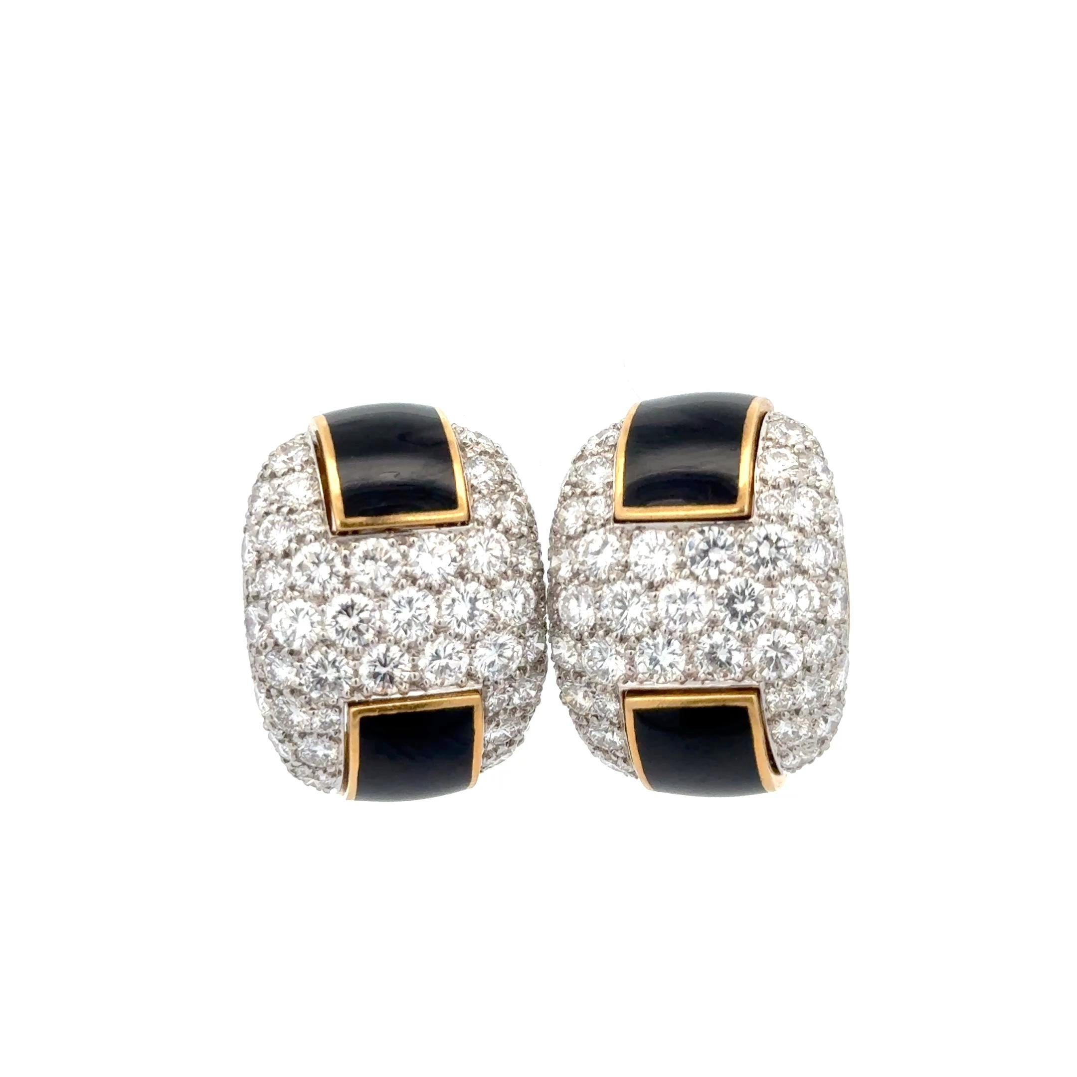 Black Enamel & Diamond Clip-on Earrings in 18K Yellow Gold. The earrings features pave set brilliant round diamonds accented by black enamel. The earrings approximately measure 1