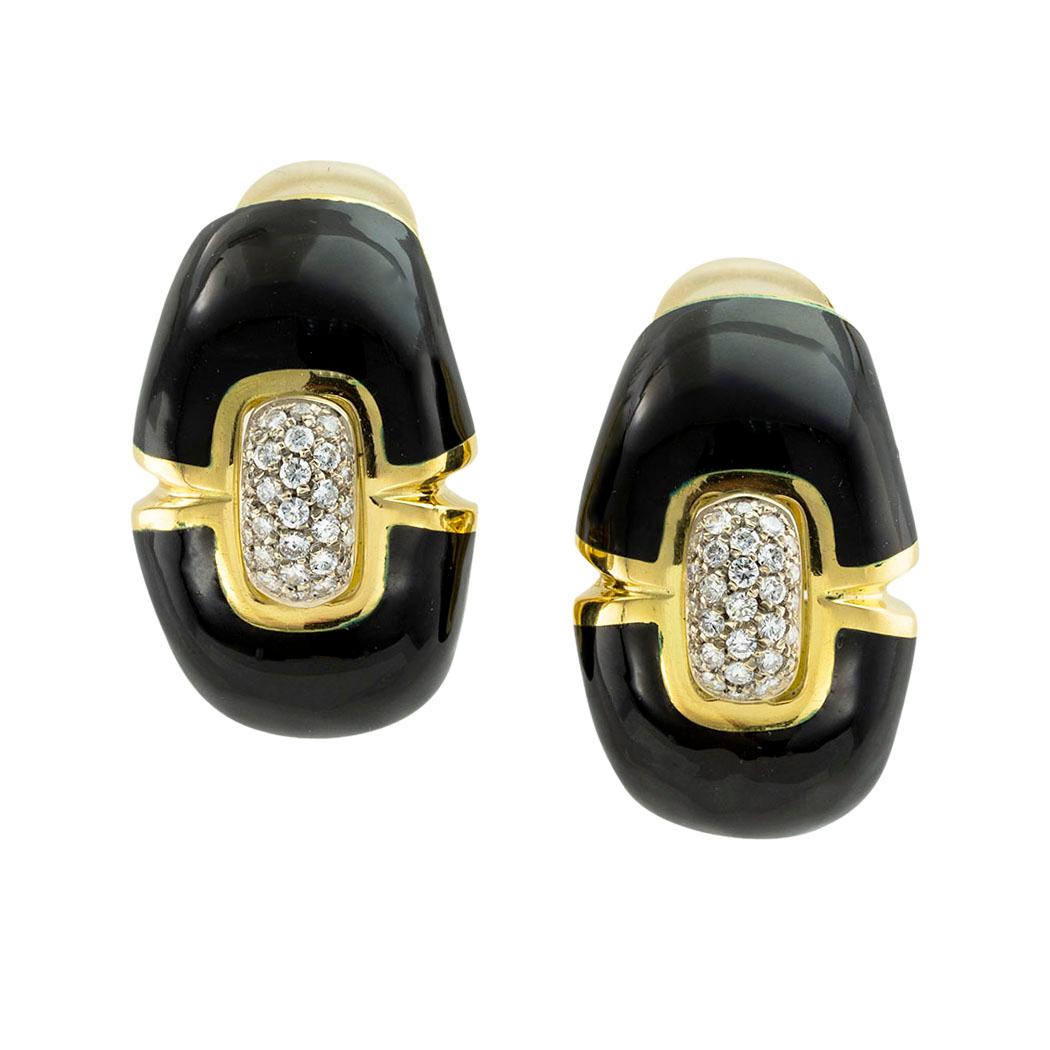 Black enamel diamond and gold clip-on and post earrings circa 1970. *

ABOUT THIS ITEM:  This is an impressive pair of earrings with substance and presence.  The bonus of hinged and retractable posts is a very desirable feature.  That way they can