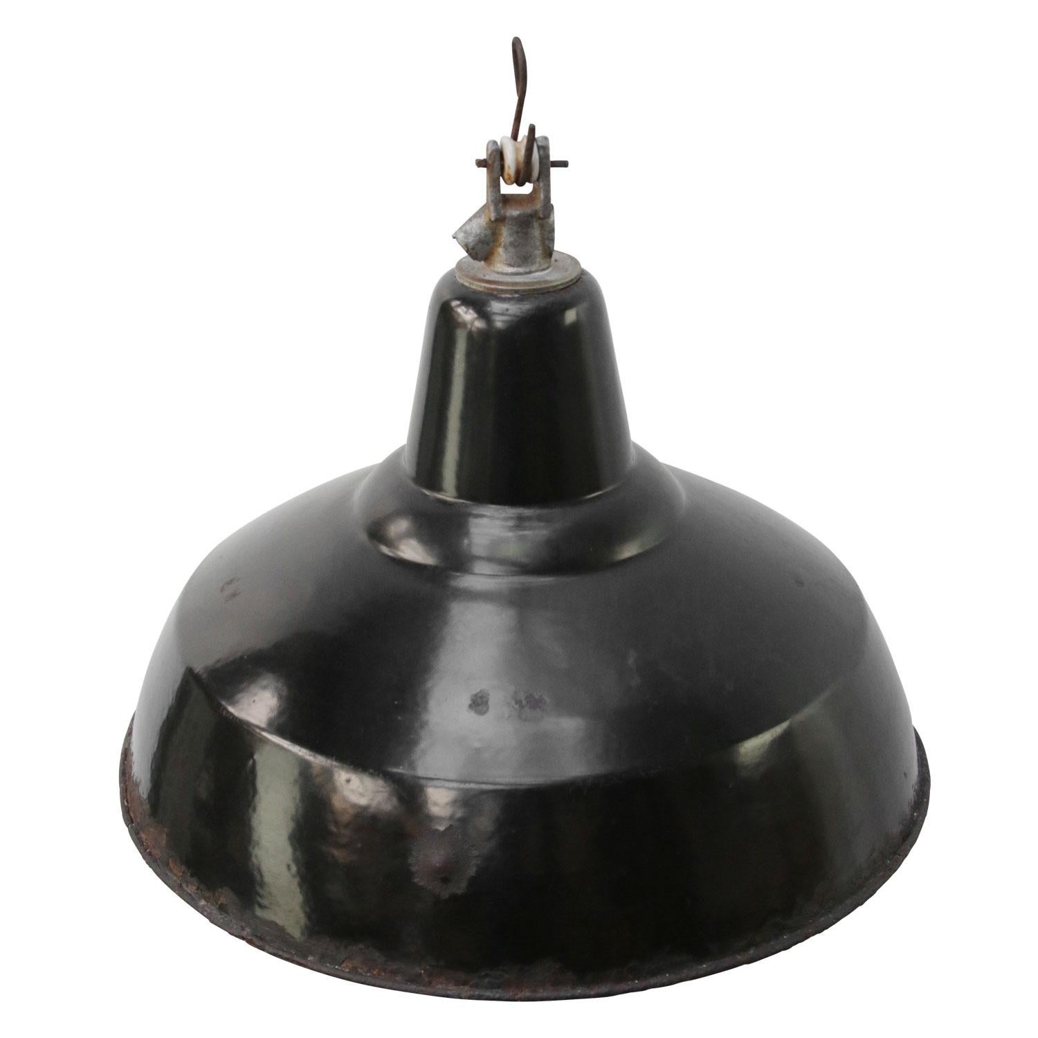 Dutch industrial hanging lamp. Black enamel white interior.

Weight: 1.5 kg / 3.3 lb

Priced per individual item. All lamps have been made suitable by international standards for incandescent light bulbs, energy-efficient and LED bulbs. E26/E27