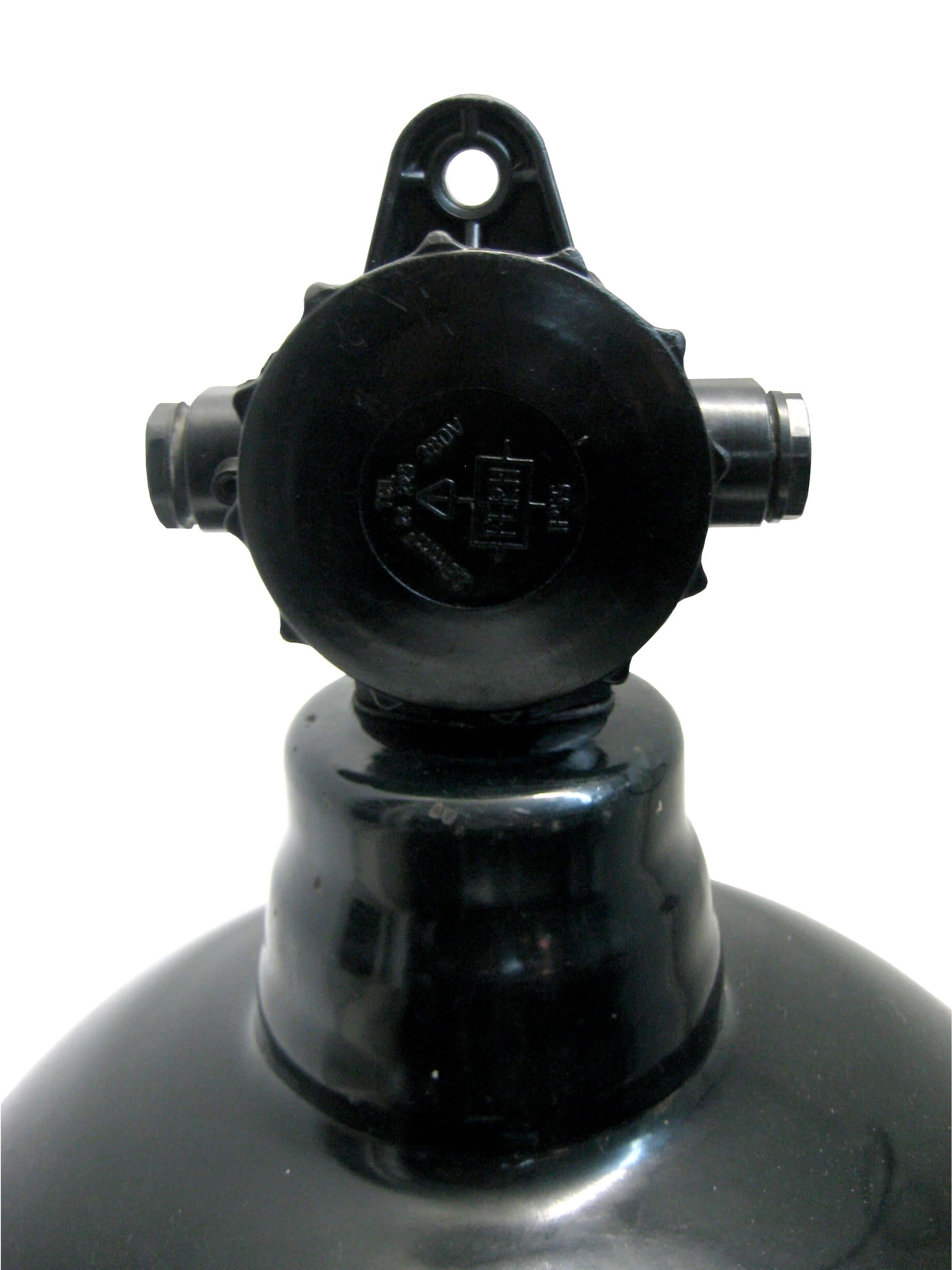 The German industrial classic! Used in warehouses and factories in Germany. Black enamel top with Bakelite top.

Weight: 2.2 kg / 4.9 lb

Priced per individual item. All lamps have been made suitable by international standards for incandescent light