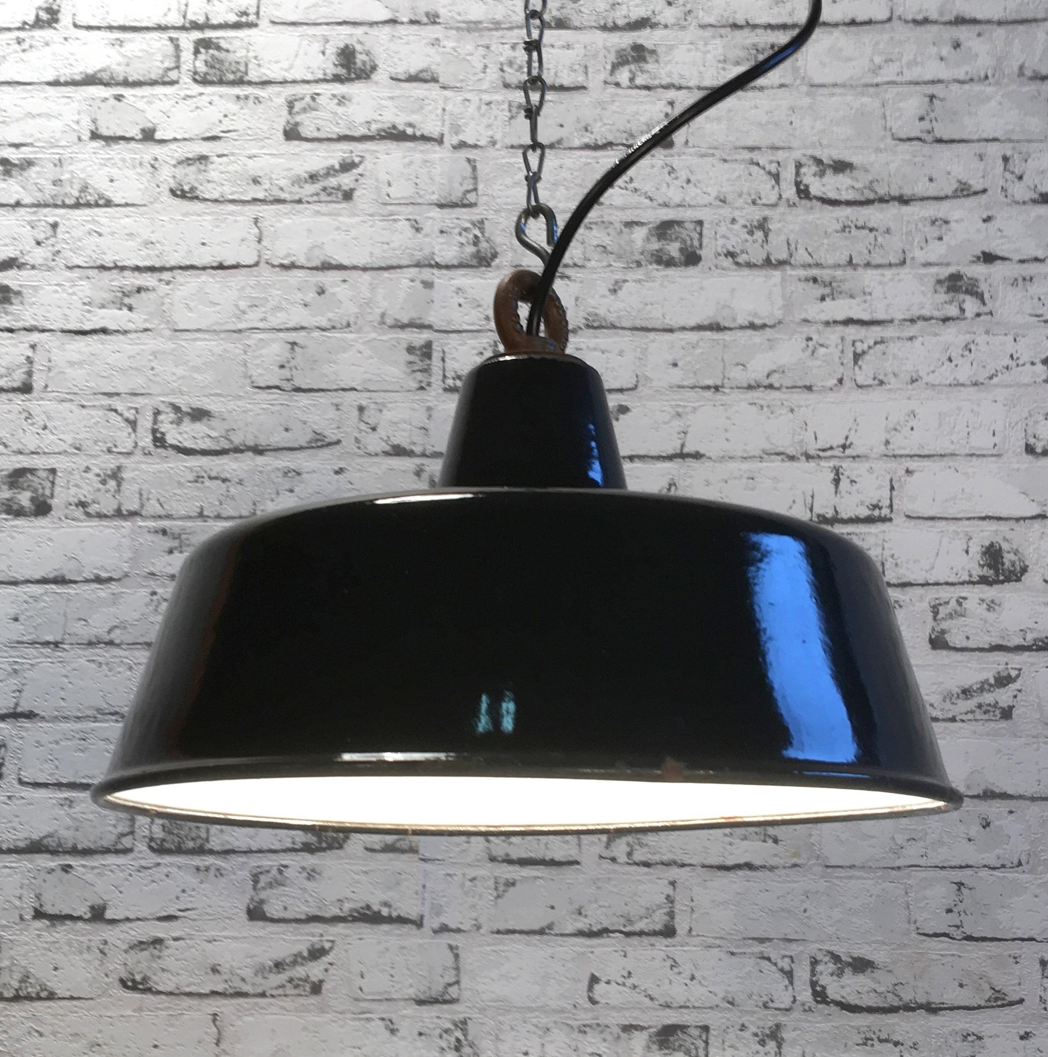 Industrial black enamel lamp. White interior. Cast iron top. 
New porcelain socket E 27 and wire.
