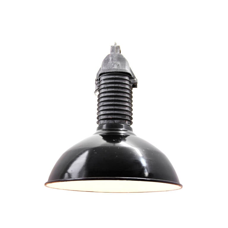 Black industrial hanging lamps, with cast aluminum top. 

Weight: 4.40 kg / 9.7 lb

Priced per individual item. All lamps have been made suitable by international standards for incandescent light bulbs, energy-efficient and LED bulbs. E26/E27