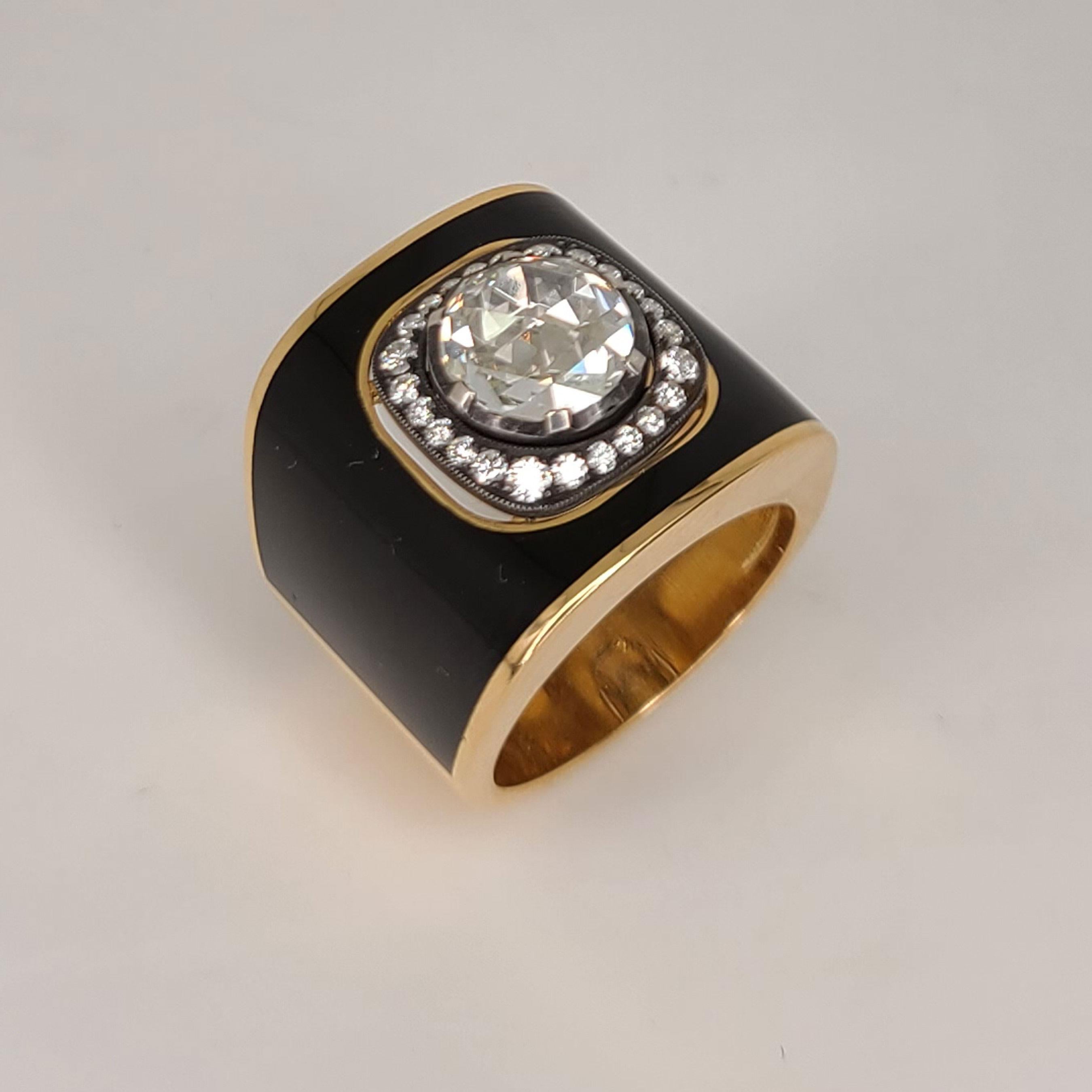 This rare 18K Rose Gold Ring is inlay-ed with black French enameling and a center Rose-cut Diamond of 1.62cts and has pave-set Diamonds of 0.30cts around it. Only the center stone is set on a silver to maintain its classic fashion characteristics as