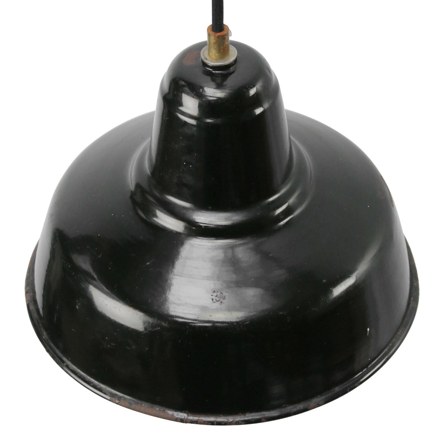 Dutch Industrial hanging lamp. Black enamel white interior.

Weight: 0.95 kg / 2.1 lb

Priced per individual item. All lamps have been made suitable by international standards for incandescent light bulbs, energy-efficient and LED bulbs. E26/E27