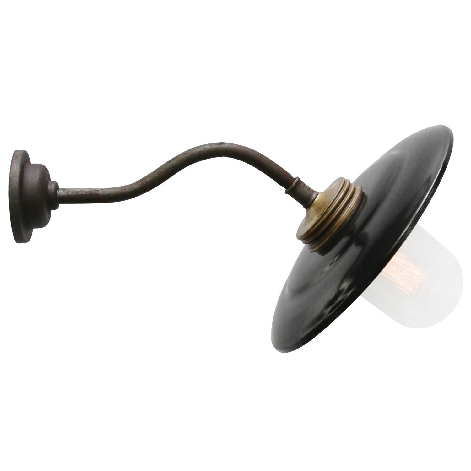 Black enamel industrial wall light with white interior.
Cast iron with brass top, clear striped glass. 

Diameter cast iron wall mount: 10.5 cm / 4”.
2 holes to secure.

Weight: 2.60 kg / 5.7 lb

Priced per individual item. All lamps have been made