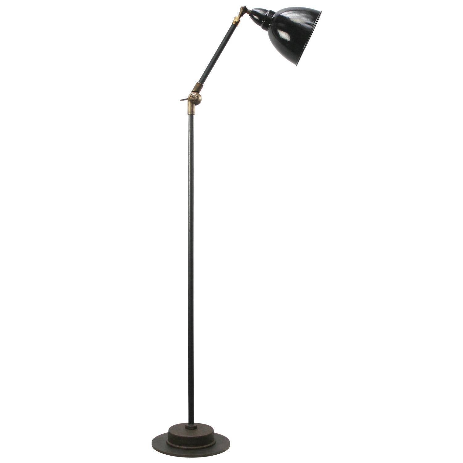 Black Enamel Vintage industrial workshop floor lamp
Cast iron with brass joints
Adjustable in angle.

Diameter foot 23 cm

Electric wire 2 meter / 80” with plug and floor switch

Available with UK / US plug

Priced per individual item. All lamps