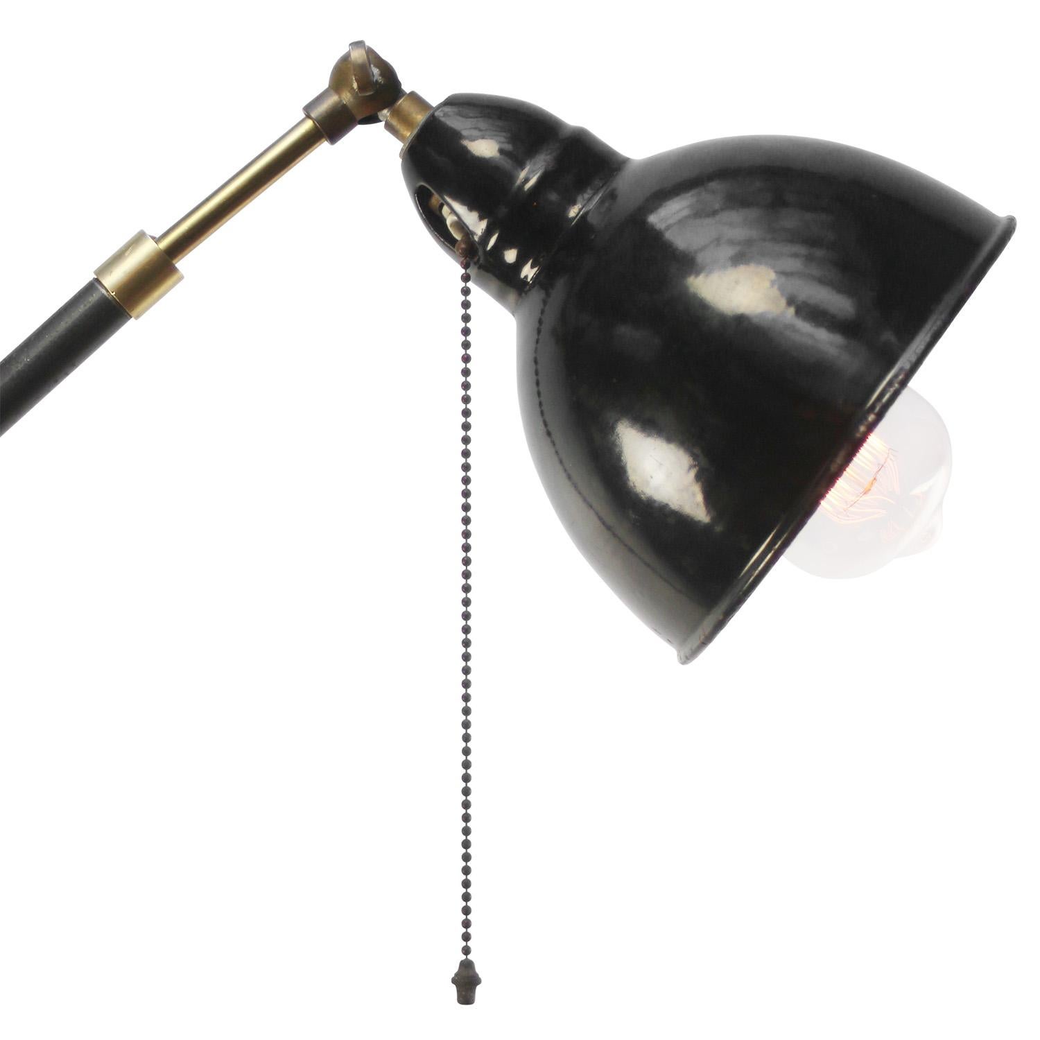 Black Enamel Vintage industrial workshop floor lamp
Pull switch in shade
Cast iron with brass joints
Adjustable in angle. 

Diameter foot 23 cm

Electric wire 2 meter / 80” with plug and floor switch

Available with UK / US plug

Priced per