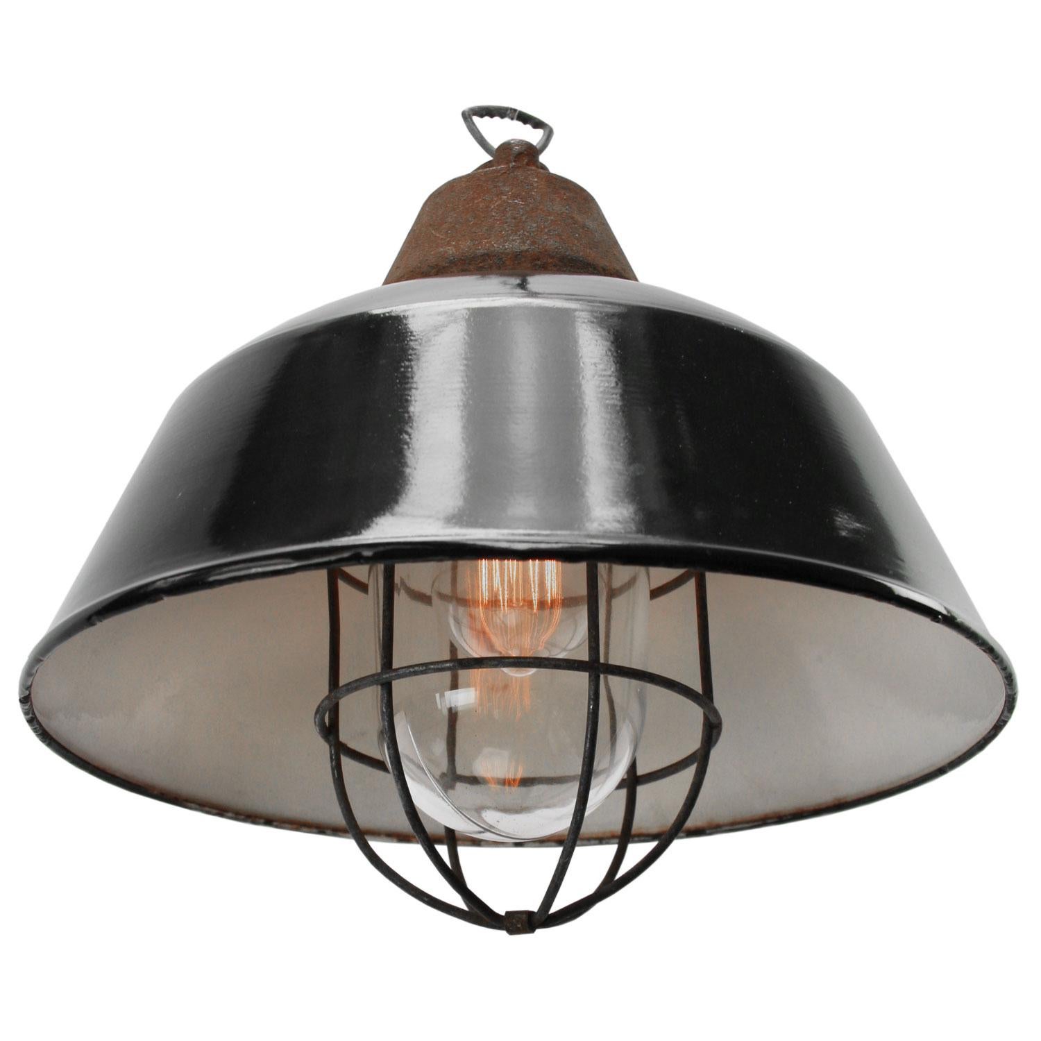 Factory pendant
black enamel white interior
cast iron top with clear glass with cage

Weight 3.40 kg / 7.5 lb

Priced per individual item. All lamps have been made suitable by international standards for incandescent light bulbs,
