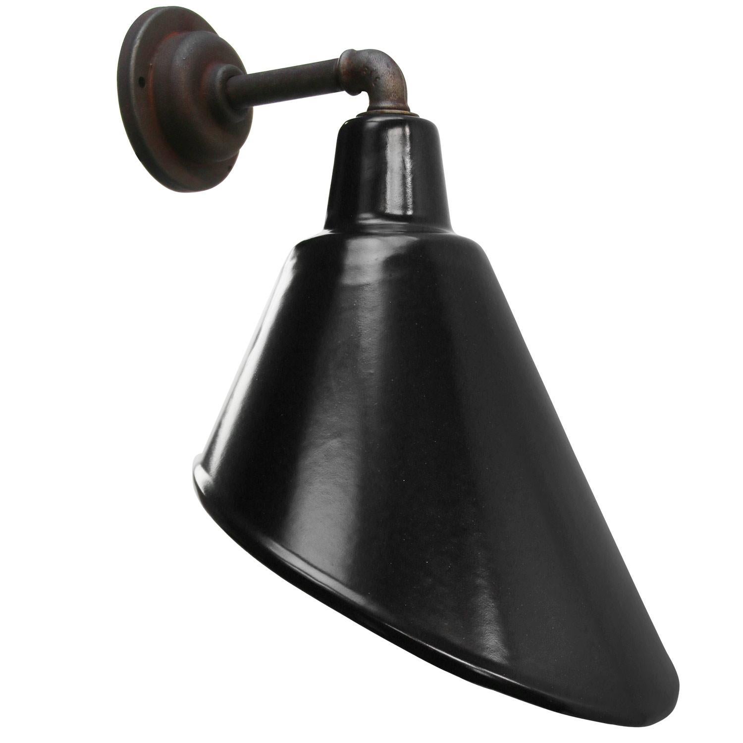 Factory wall light
Black enamel, white interior

Diameter cast iron wall piece:  10.5 cm / 4”.
2 holes to secure

Weight: 2.00 kg / 4.4 lb

Priced per individual item. All lamps have been made suitable by international standards for incandescent