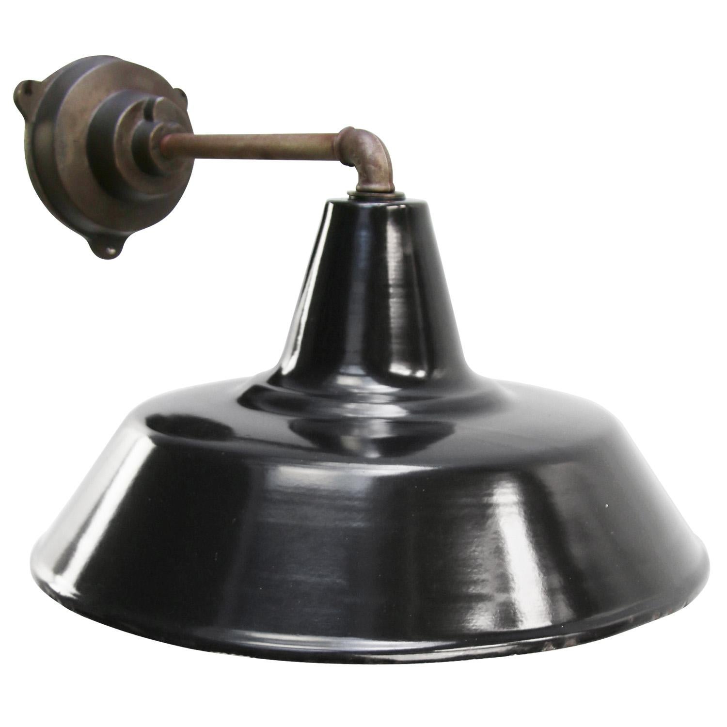 factory wall light
black enamel, white interior

Diameter cast iron wall piece: 12 cm, 3 holes to secure

Weight: 3.10 kg / 6.8 lb

Priced per individual item. All lamps have been made suitable by international standards for incandescent