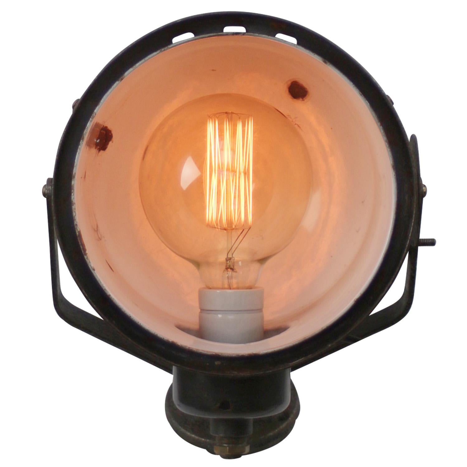 Adjustable industrial wall light
Black enamel, cast iron parts and wall piece

Measure: diameter wall mount 10.5 cm / 4”

Weight: 3.00 kg / 6.6 lb

Priced per individual item. All lamps have been made suitable by international standards for