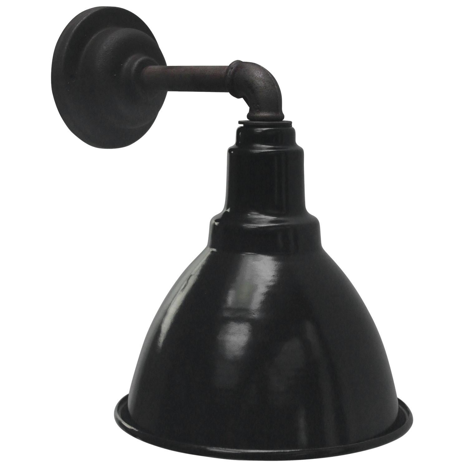 Industrial wall light
Black enamel shade, cast iron arm and wall plate

Diameter cast iron wall piece: 10 cm, 2 holes to secure

Weight: 1.80 kg / 4 lb

Priced per individual item. All lamps have been made suitable by international standards