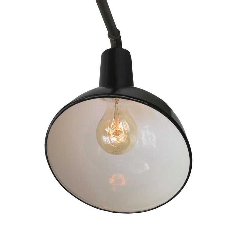 Factory wall light. Black enamel. White interior. Measures: Diameter cast iron wall piece 12 cm, 3 holes to secure.

Weight: 2.9 kg / 6.4 lb

Priced per individual item. All lamps have been made suitable by international standards for