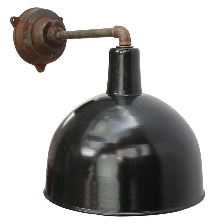 Factory wall light. Black enamel. White interior. 

Diameter cast iron wall piece: 12 cm, three holes to secure.

Weight: 3.40 kg / 7.5 lb

Priced per individual item. All lamps have been made suitable by international standards for