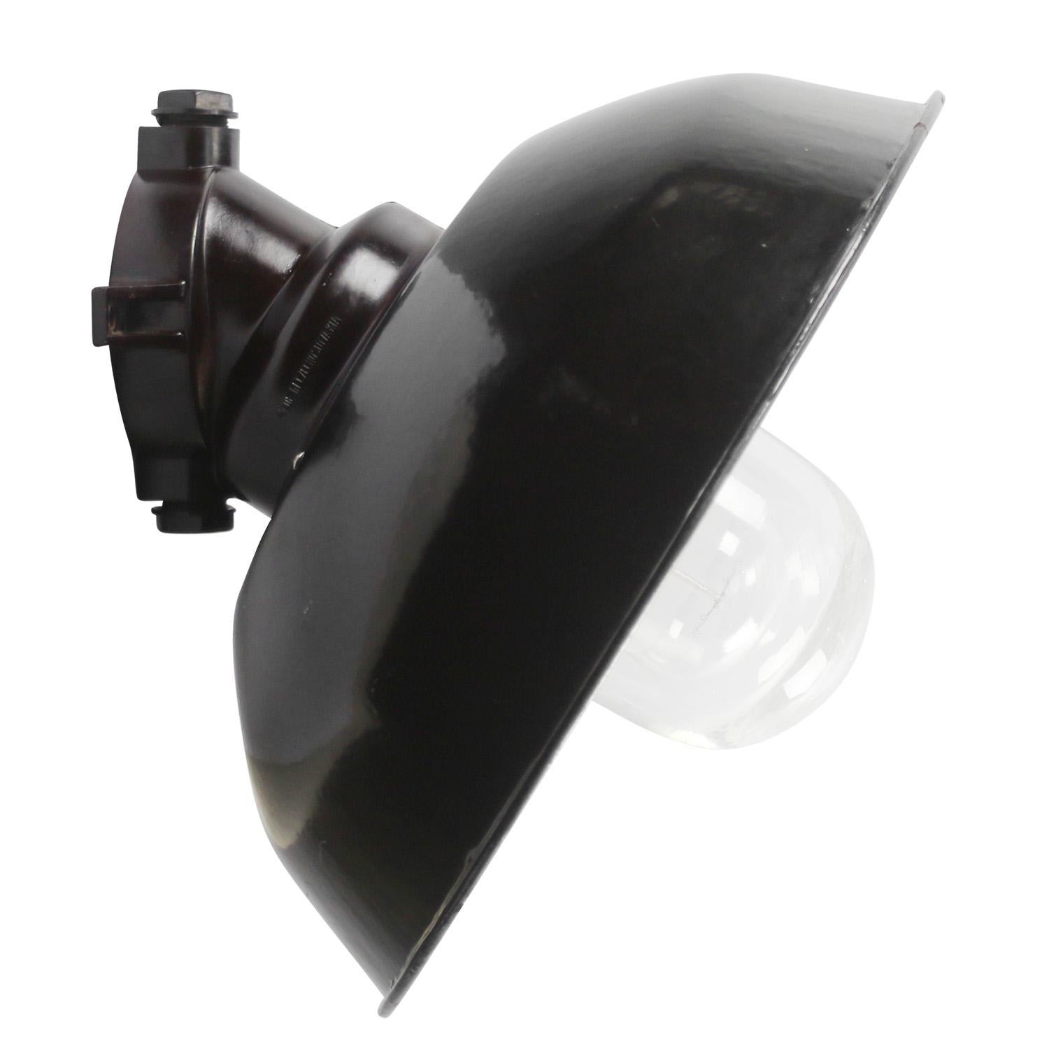 Industrial wall light.
Black enamel white interior.
Bakelite wall mount.
Clear glass.

Weight: 2.00 kg / 4.4 lb

riced per individual item. All lamps have been made suitable by international standards for incandescent light bulbs, energy-efficient