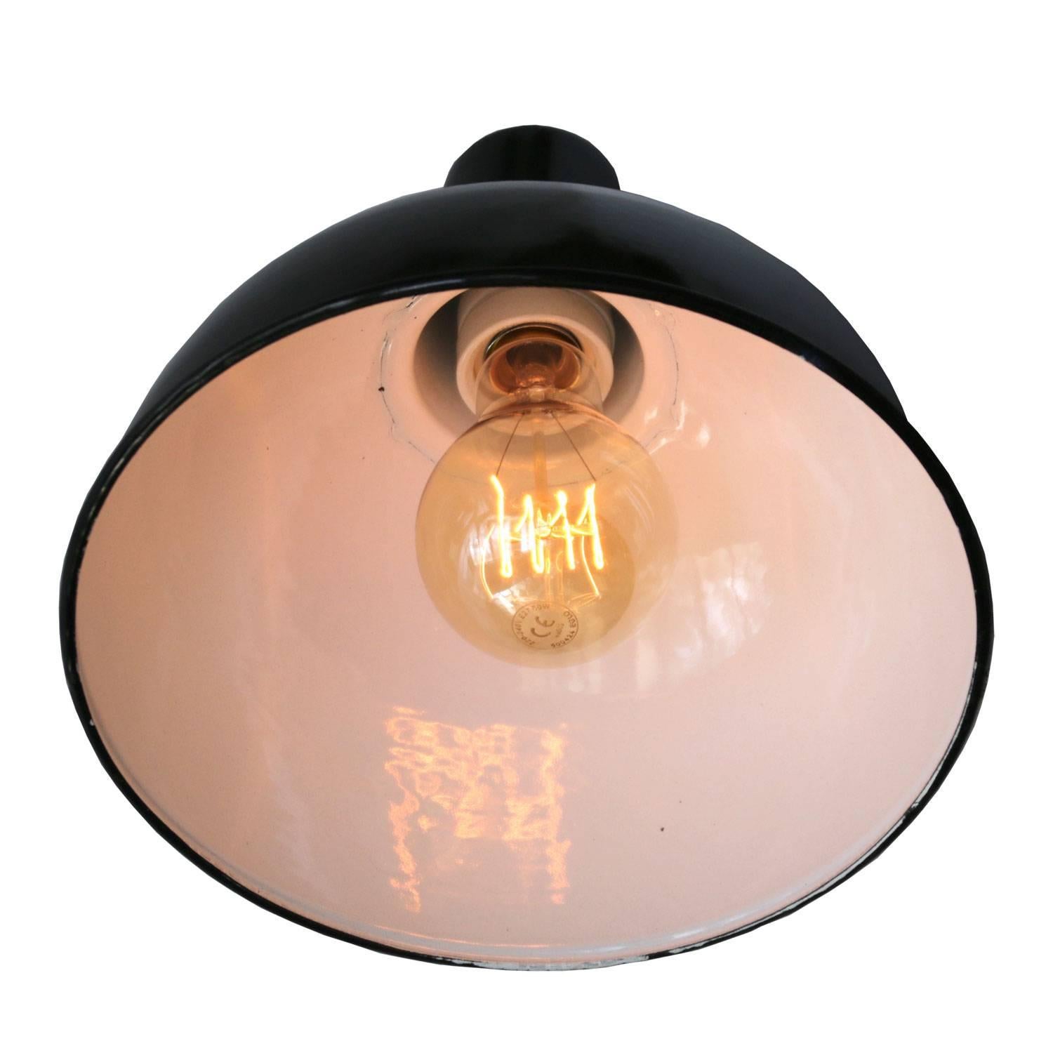 Factory hanging light. Black enamel. White interior.
Brass strain relief with 2 meter wire.  

Measure: Weight: 1.0 kg / 2.2 lb

Priced individual item. All lamps have been made suitable by international standards for incandescent light bulbs,
