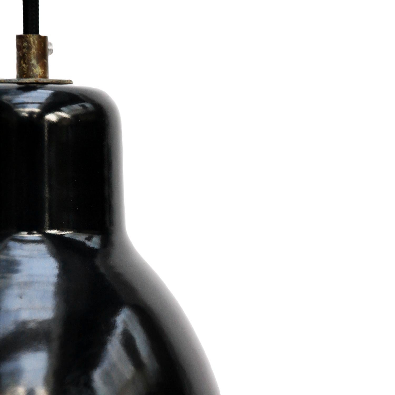Factory hanging light. Black enamel. White interior.
Brass strain relief with 2 meter wire.  

Measure: Weight: 0.6 kg / 1.3 lb

Priced per individual item. All lamps have been made suitable by international standards for incandescent light