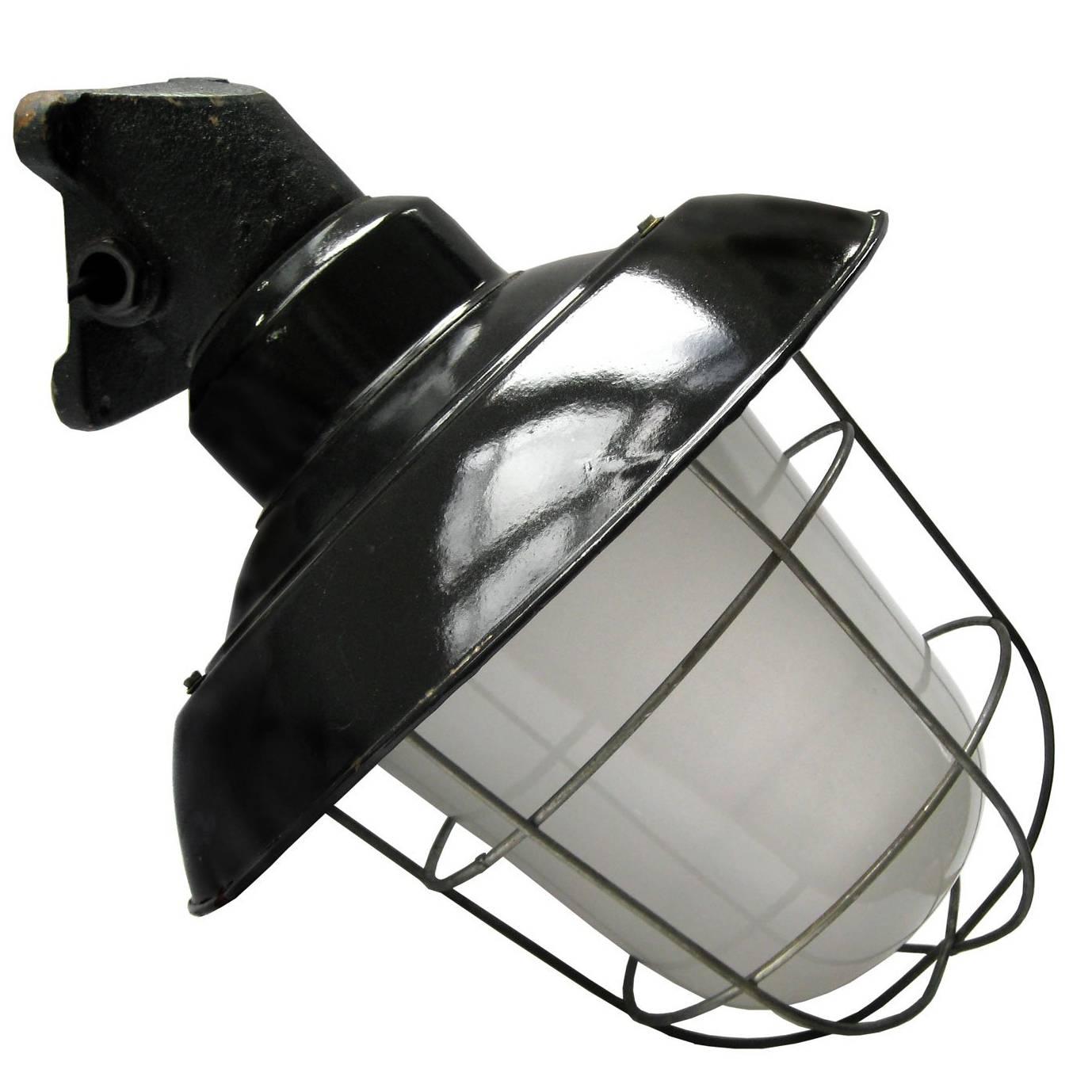 Industrial wall lamp. Cast iron arm. Black enamel shade. White interior. Frosted glass.

Weight: 5.0 kg / 11 lb

Priced per individual item. All lamps have been made suitable by international standards for incandescent light bulbs, energy-efficient