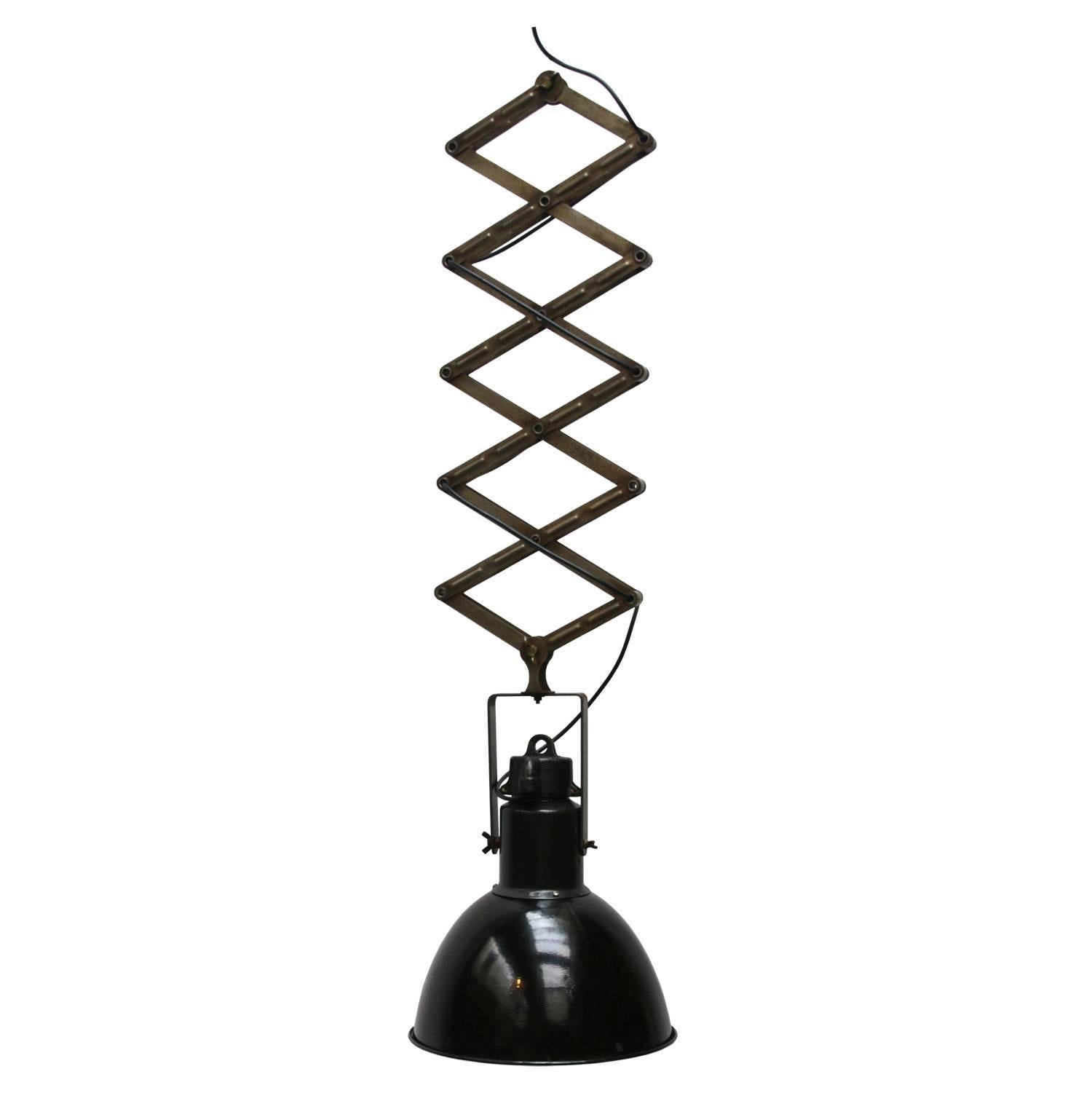 Scissor spring with industrial hanging lamp. 
Black enamel white interior. Max. length 250cm. Min. length 80cm.

Measure: Weight 6.5 kg / 14.3 lb

Priced per individual item. All lamps have been made suitable by international standards for