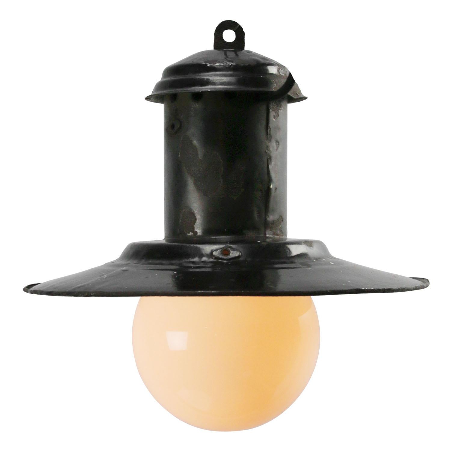 Black enamel factory pendant
White inside. White opaline glass

Measures: diameter glass 15 cm

Weight 1.30 kg / 2.9 lb

Priced per individual item. All lamps have been made suitable by international standards for incandescent light bulbs,