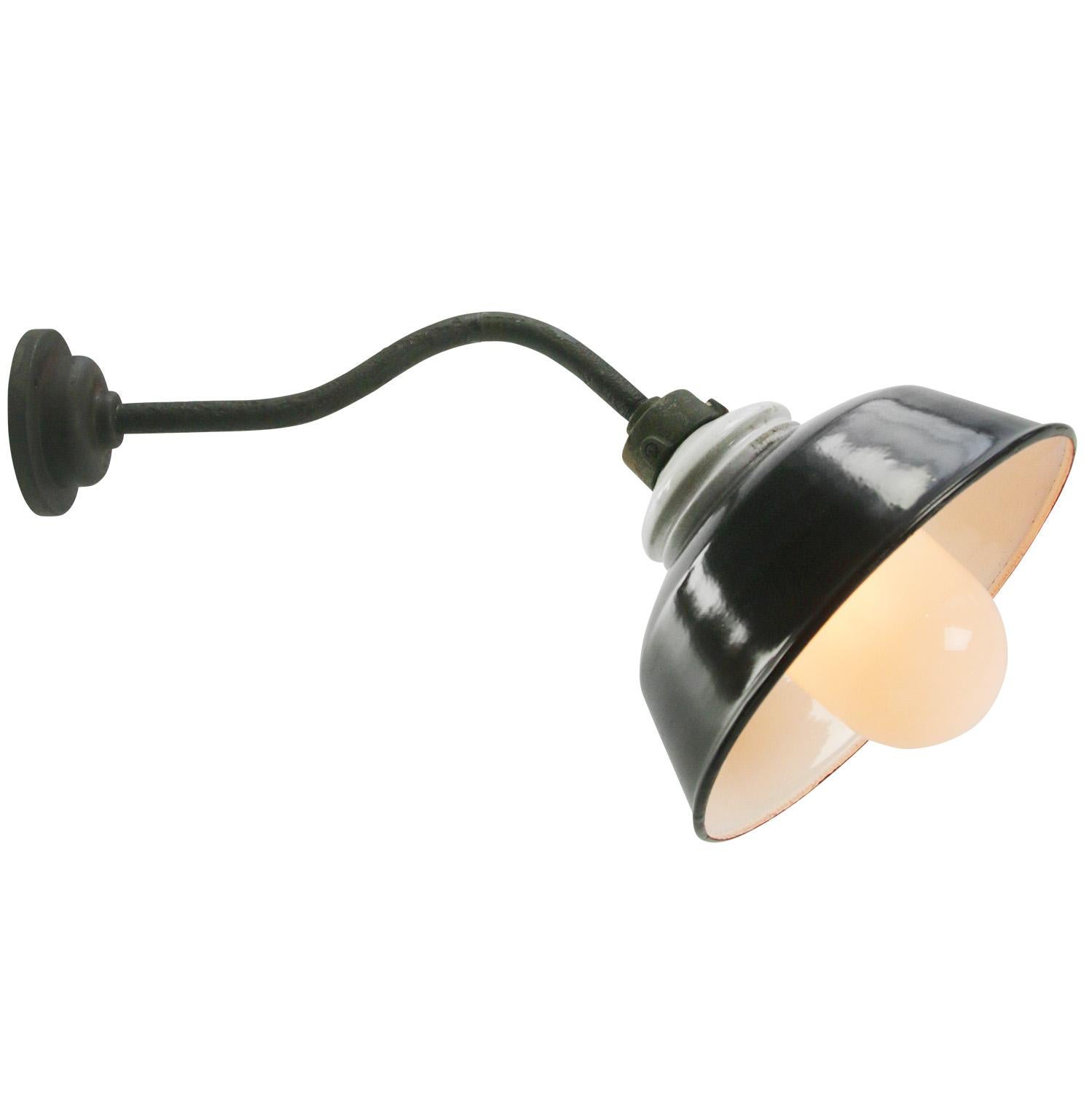 Black enamel industrial wall light with white interior.
cast iron, porcelain top, opaline glass globe.

Diameter cast iron wall mount: 10.5 cm / 4”.
2 holes to secure.

Weight: 2.30 kg / 5.1 lb

Priced per individual item. All lamps have been made