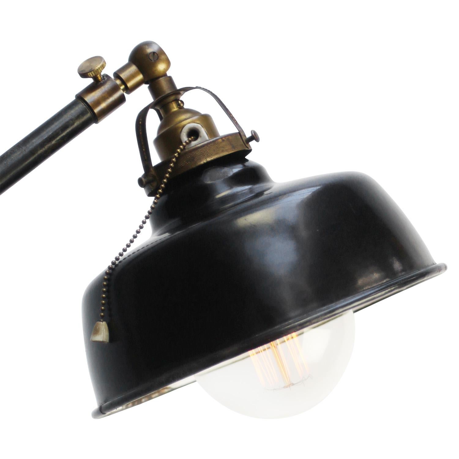 Black Enamel Vintage industrial workshop floor lamp
Cast iron with brass joints
Switch in bulb holder + foot switch
Adjustable in angle. 

Diameter foot 23 cm

Electric wire 2 meter / 80” with plug and floor switch

Available with UK / US