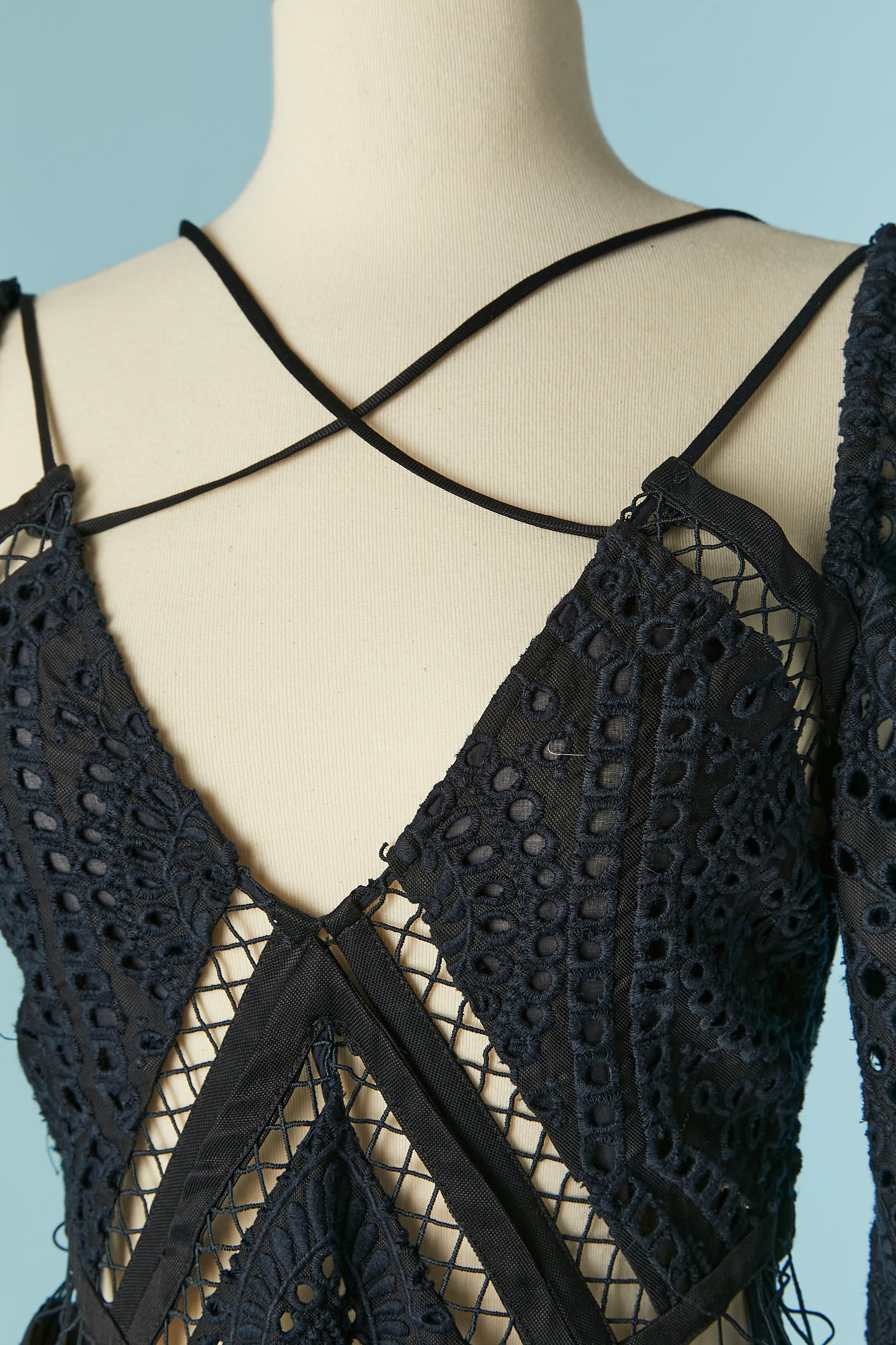 Black English embroderies see-through short-jumpsuit. Main fabric composition: 65% viscose , 20% linen, 15% rayon. Contrast: 65% viscose , 20% linen, 15% rayon. Lining: 100% cotton 
Hidden zip on the left side. 1 extra button provided. Pocket on
