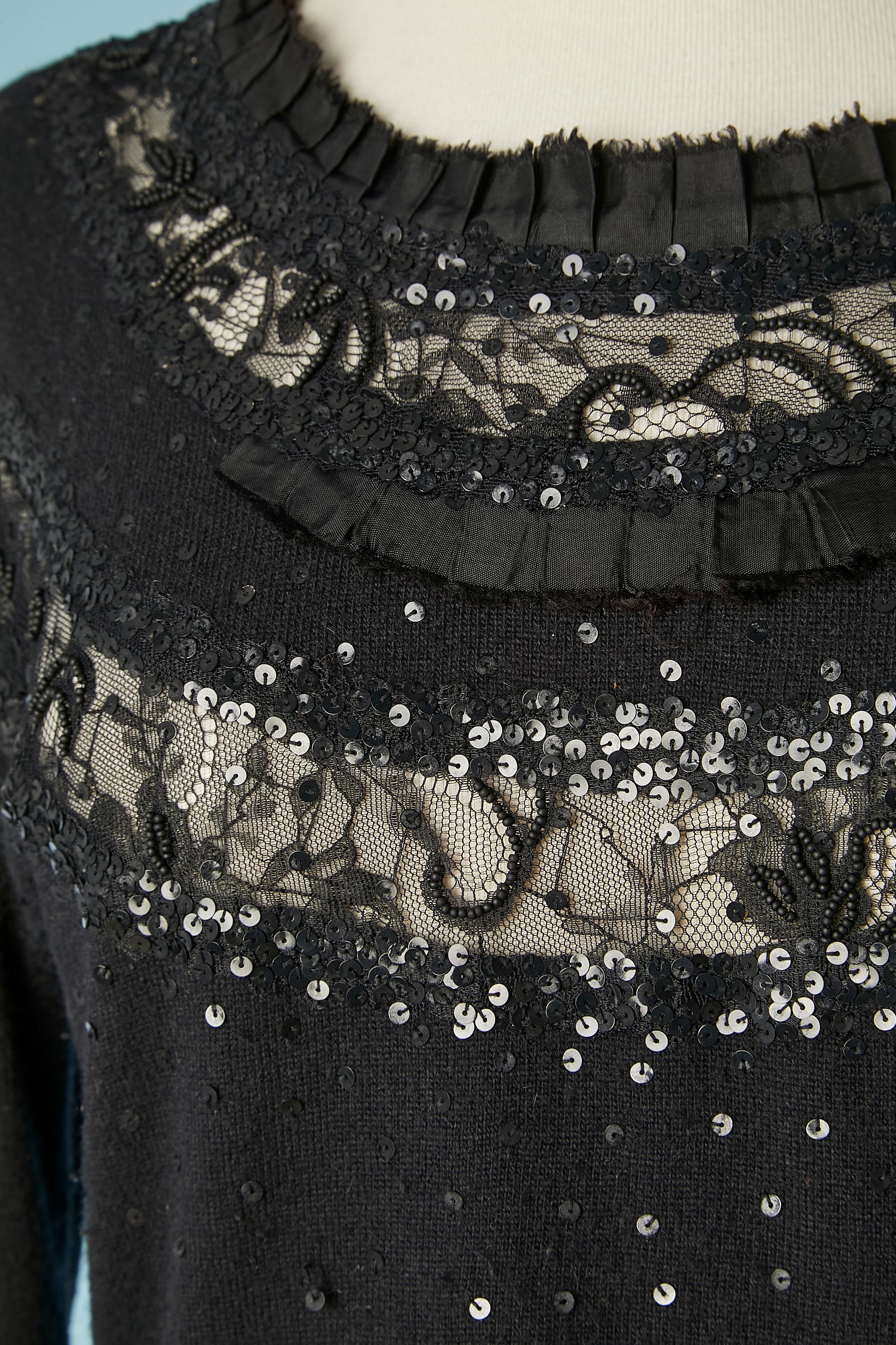 Black evening sweater with lace, sequins and beads embroideries. Fabric composition: 29% wool, 35% rayon, 20% polyamide, 6% cashmere, 8% angora. See-throught through the lace.
SIZE M