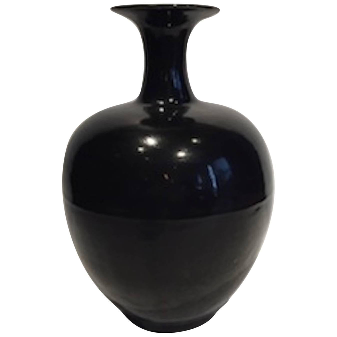 Extra large high gloss black ceramic vase from China. 
Very decorative, in unique and interesting shapes and have a beautiful patina. 
Three are available and sold separately.
A collection of extra large vases are also available in cream